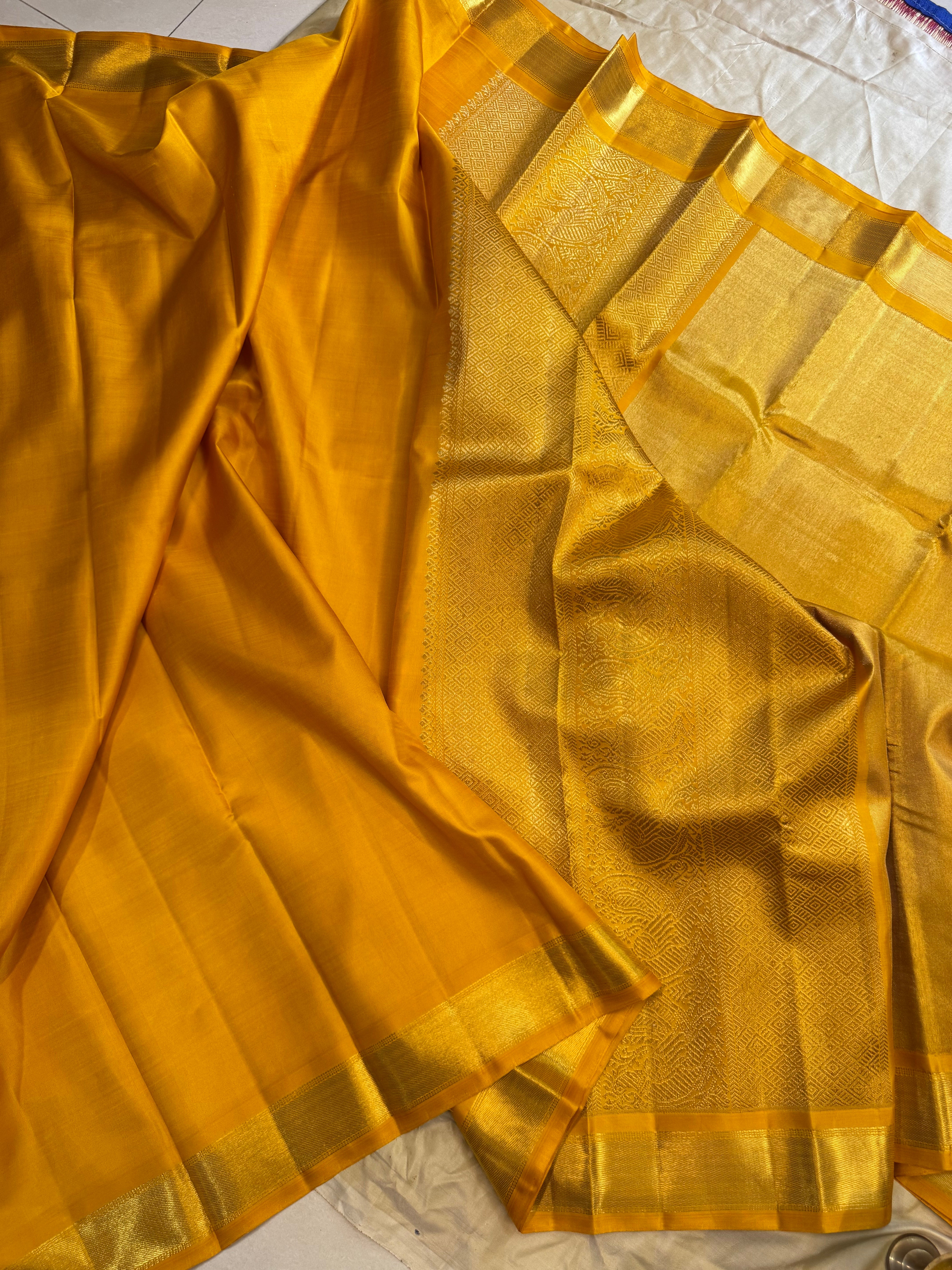Golden mustard yellow berhampuri style long Palla kanjipuram silk.