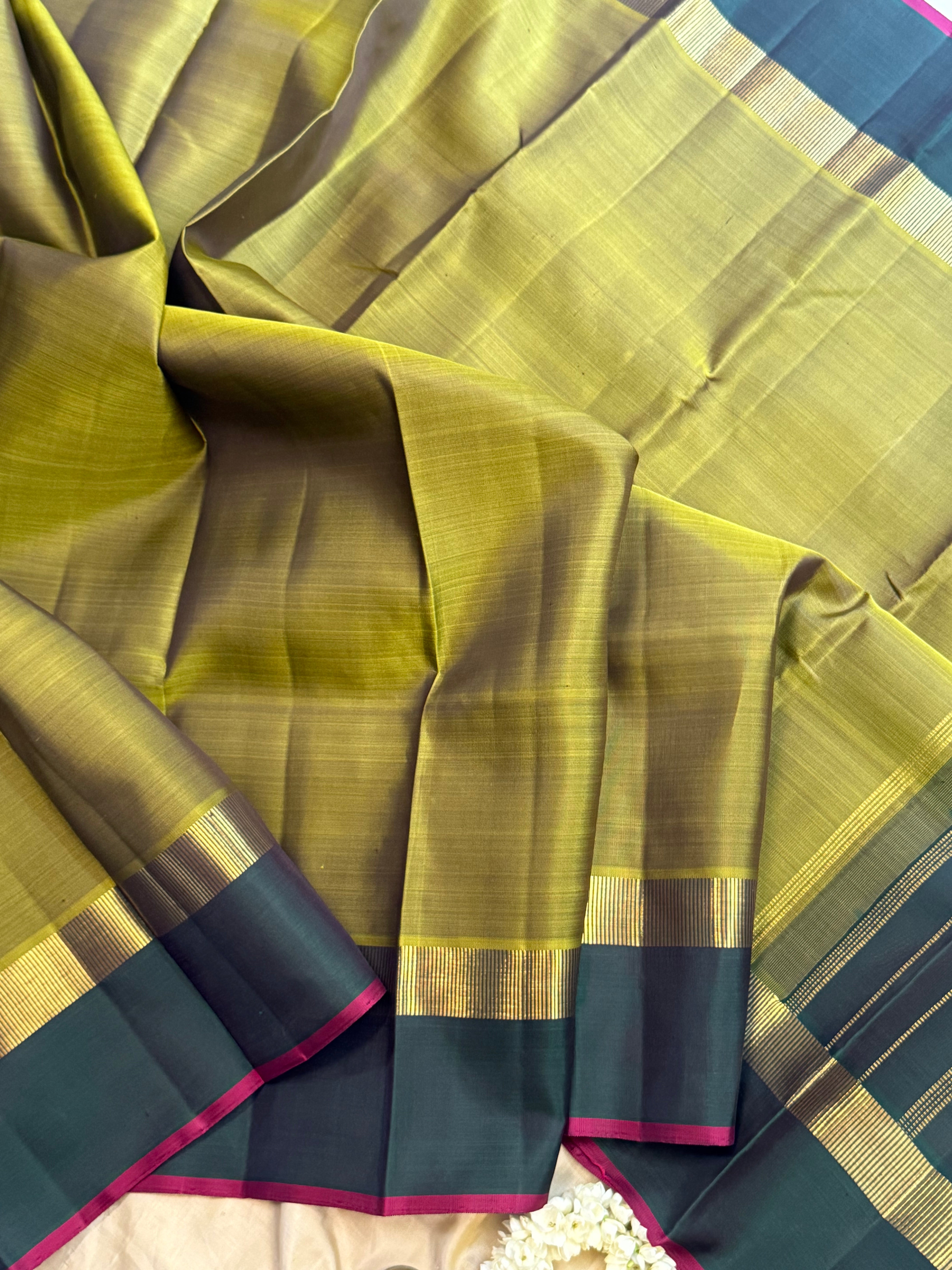 Olive green and dark green kaal erangina border/ Kanjipuram silk