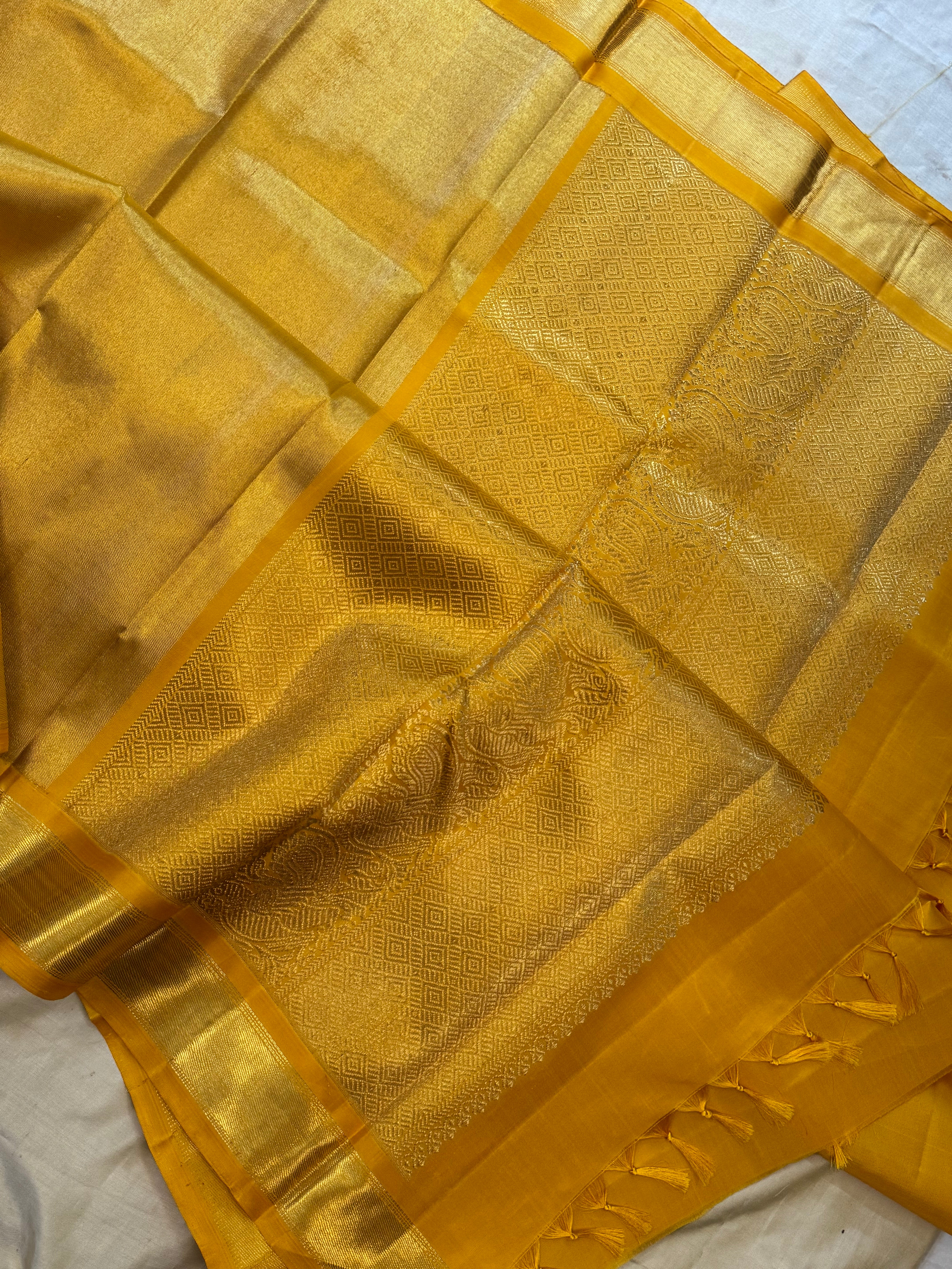 Golden mustard yellow berhampuri style long Palla kanjipuram silk.