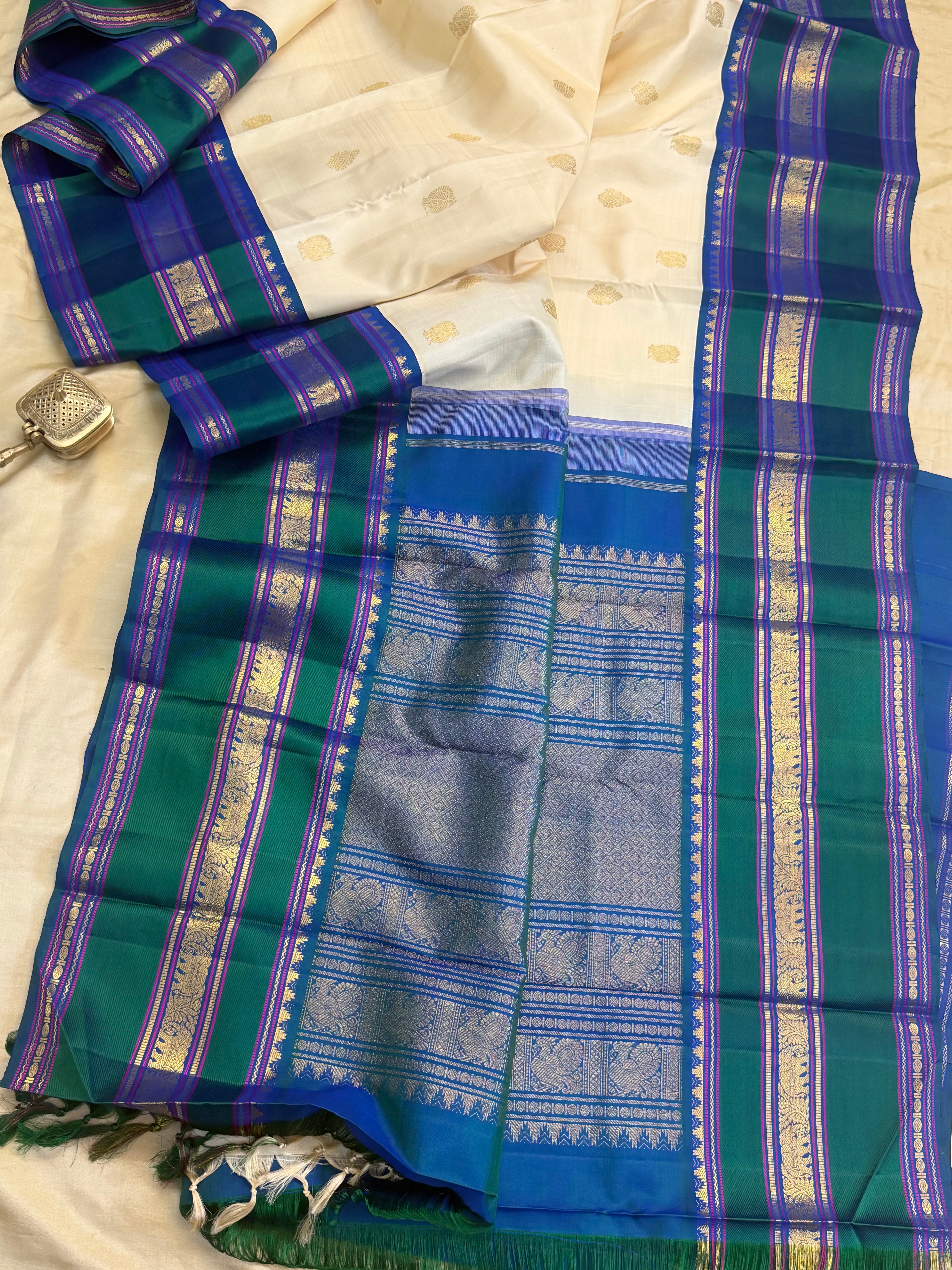 Onam collection: off white triple pet Korvai / pure zari Kanjipuram silk