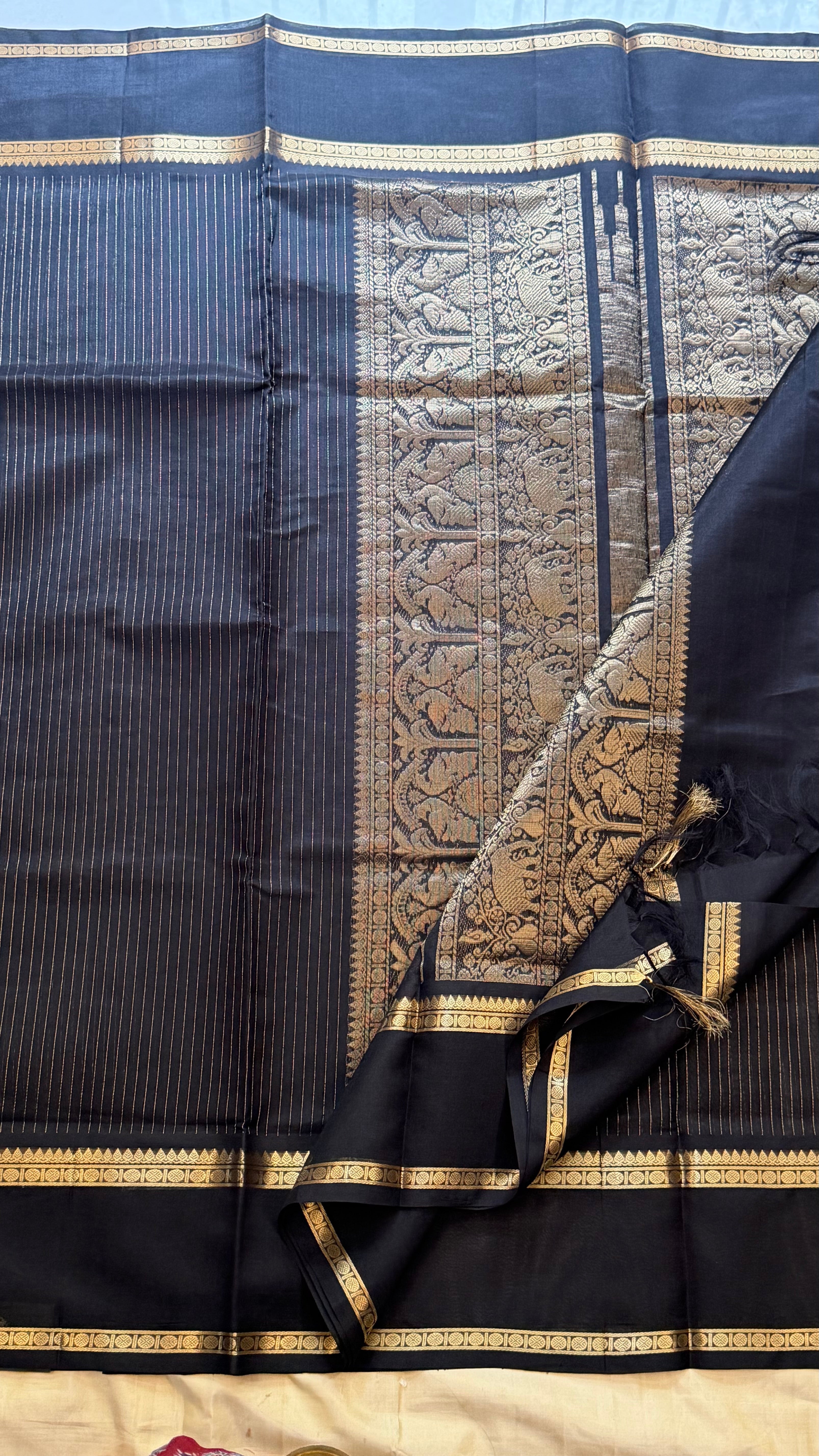 Muthu Oosi black silk cotton.