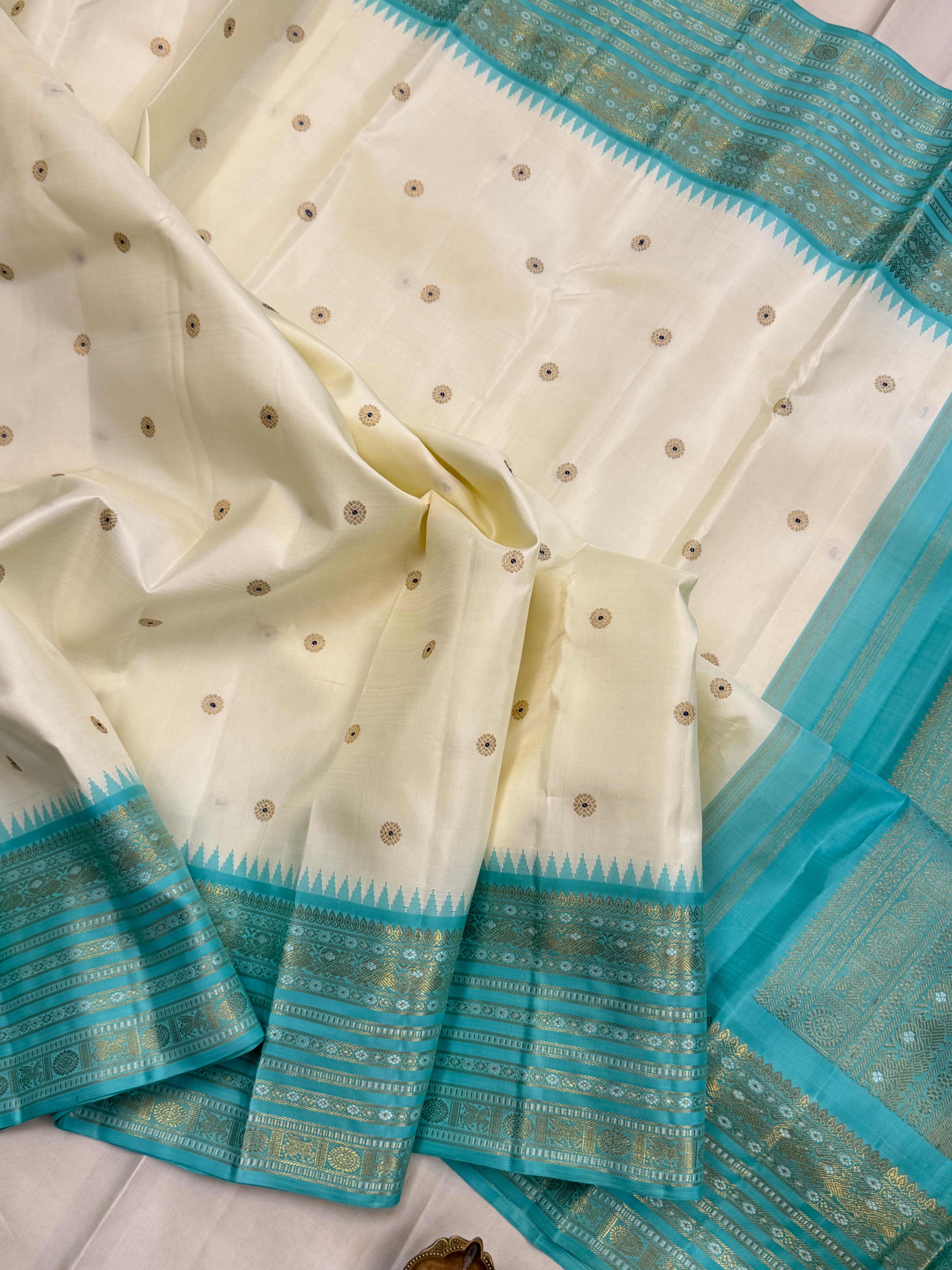 Off white with aqua blue Meenakari Butta with varisapet border Korvai / kanjipuram silk saree