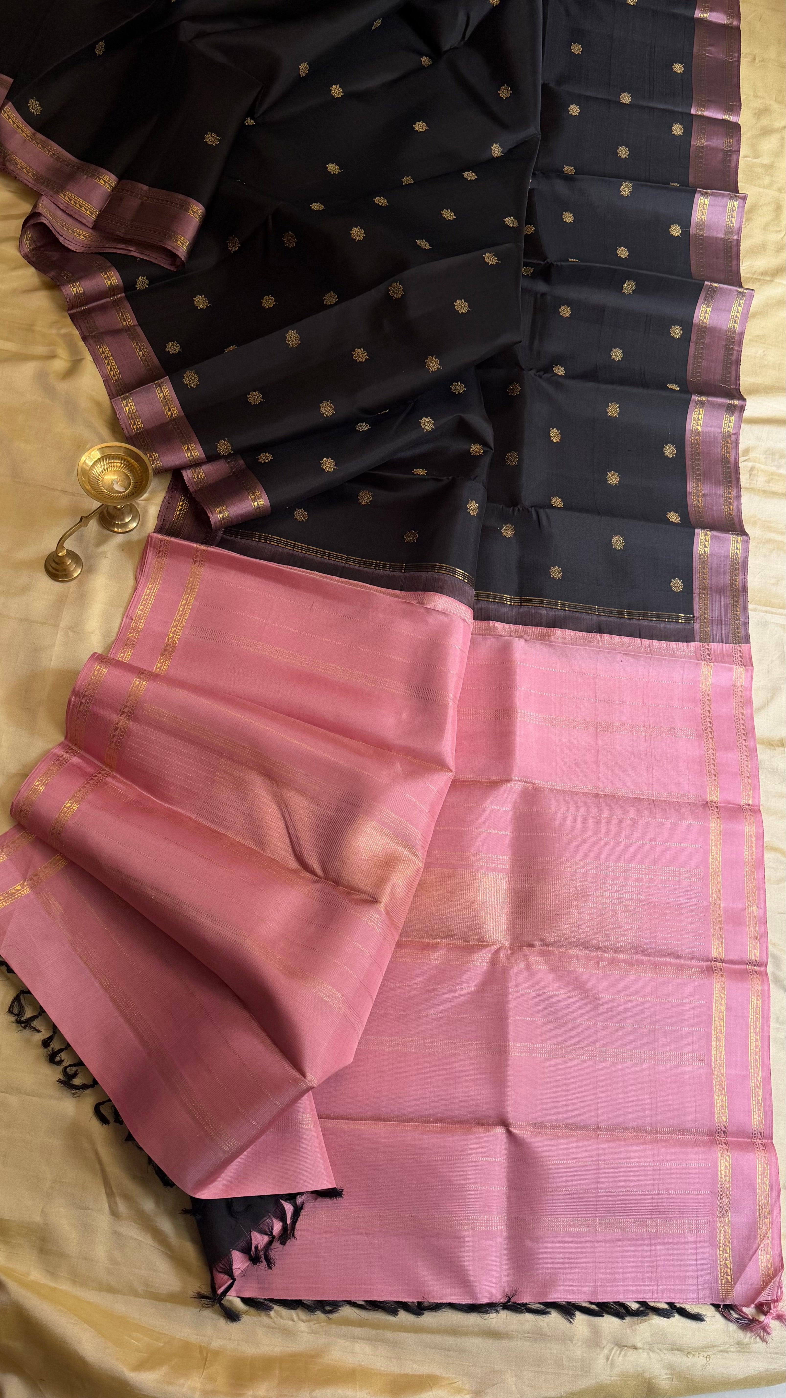 Vizhli: Black dusky pink retta pet border / Kanjipuram silk