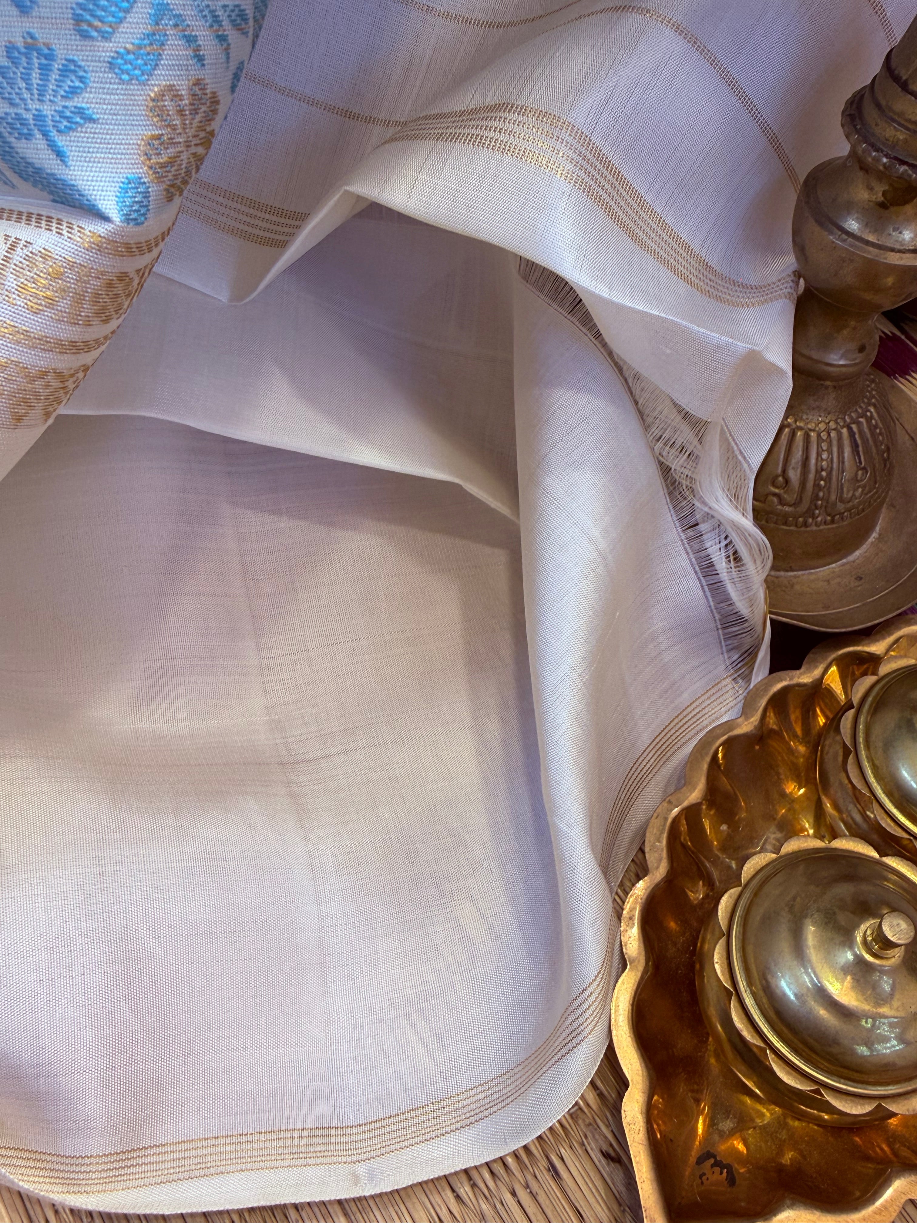 Offwhite Iruthalaipakshi and chakram butta unique pallu/ Kanjipuram silk CL10137