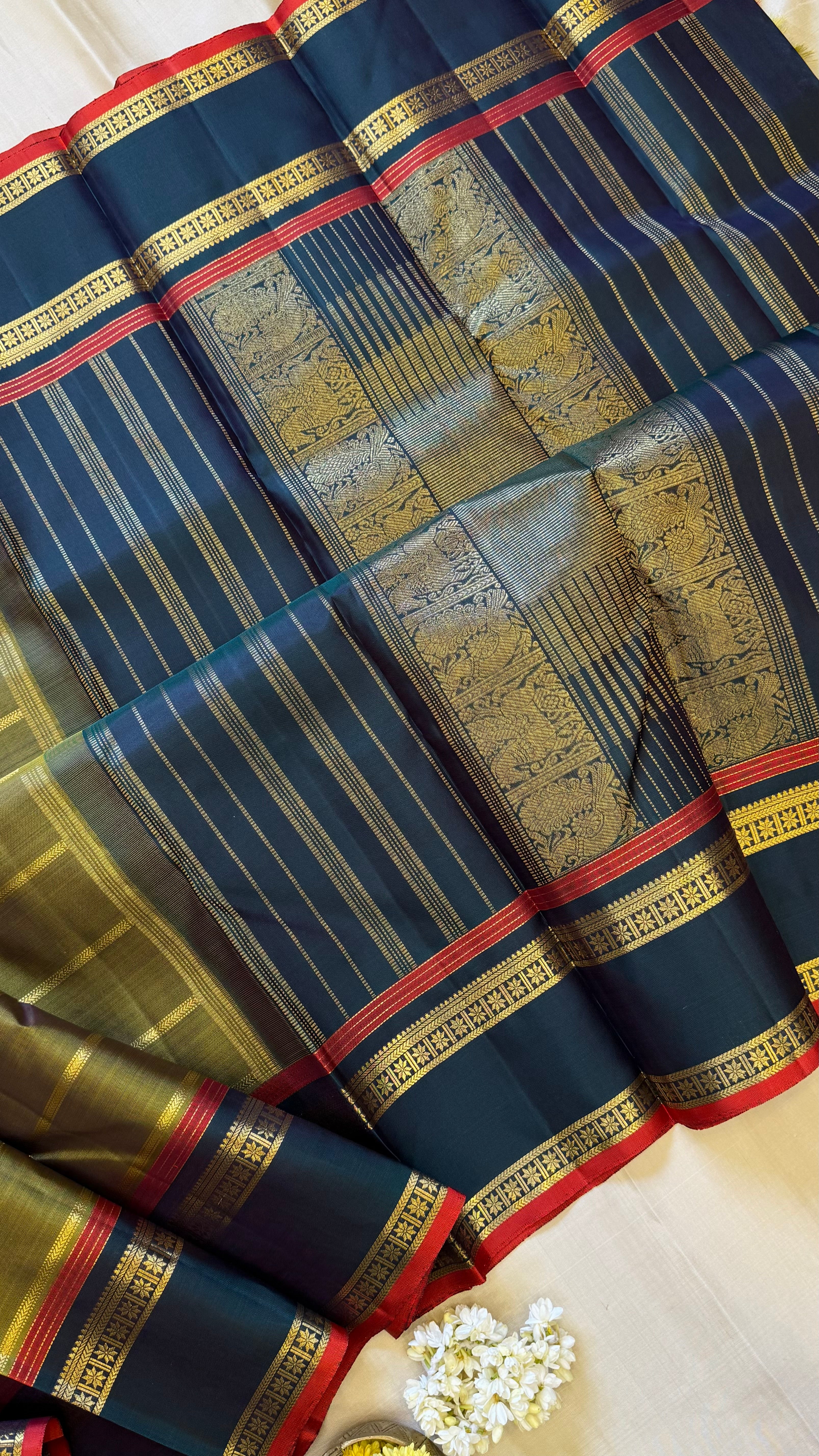 Mehandi green veldhari and rettapet border/ kanjipuram silk