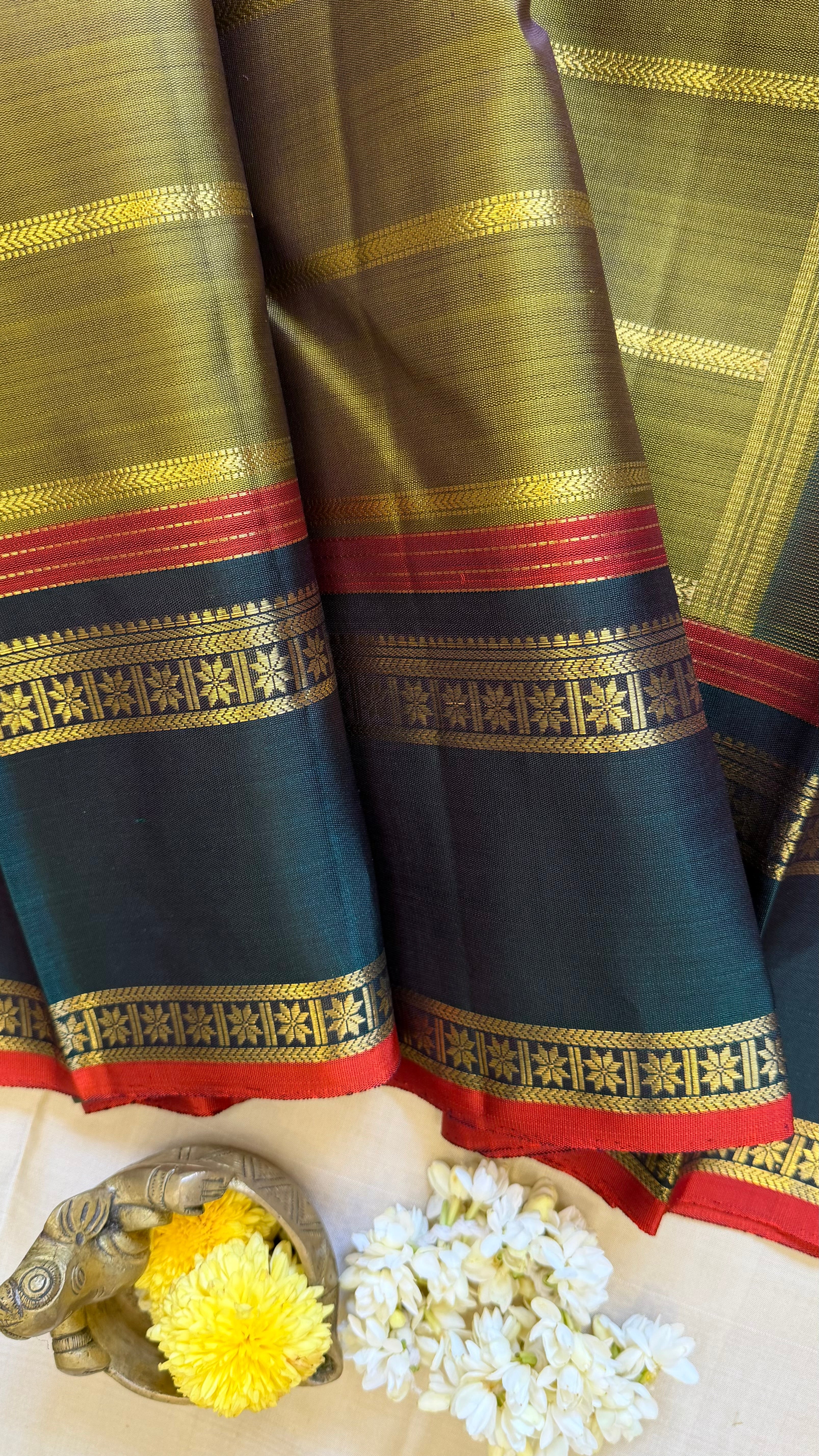 Mehandi green veldhari and rettapet border/ kanjipuram silk
