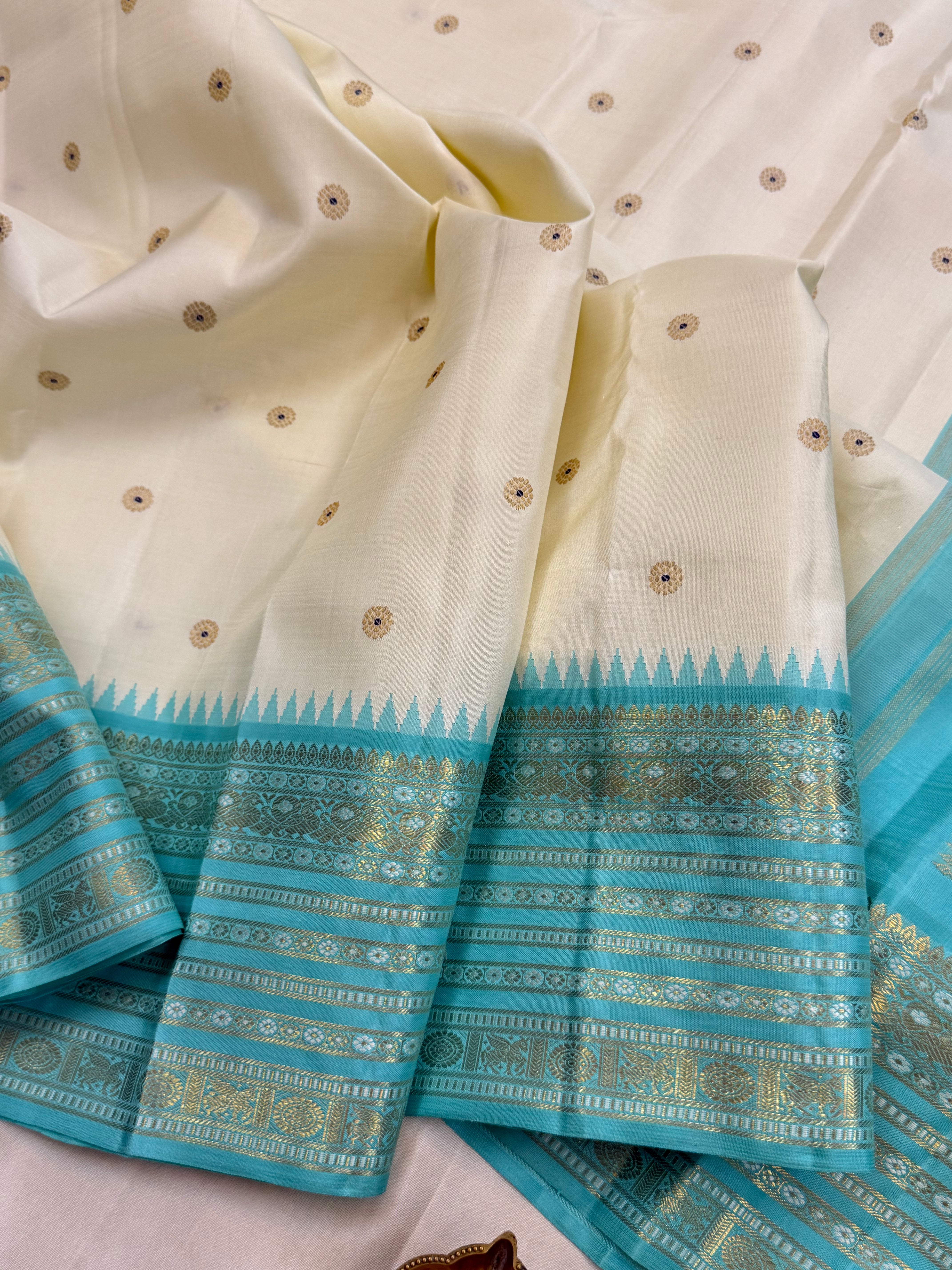 Off white with aqua blue Meenakari Butta with varisapet border Korvai / kanjipuram silk saree