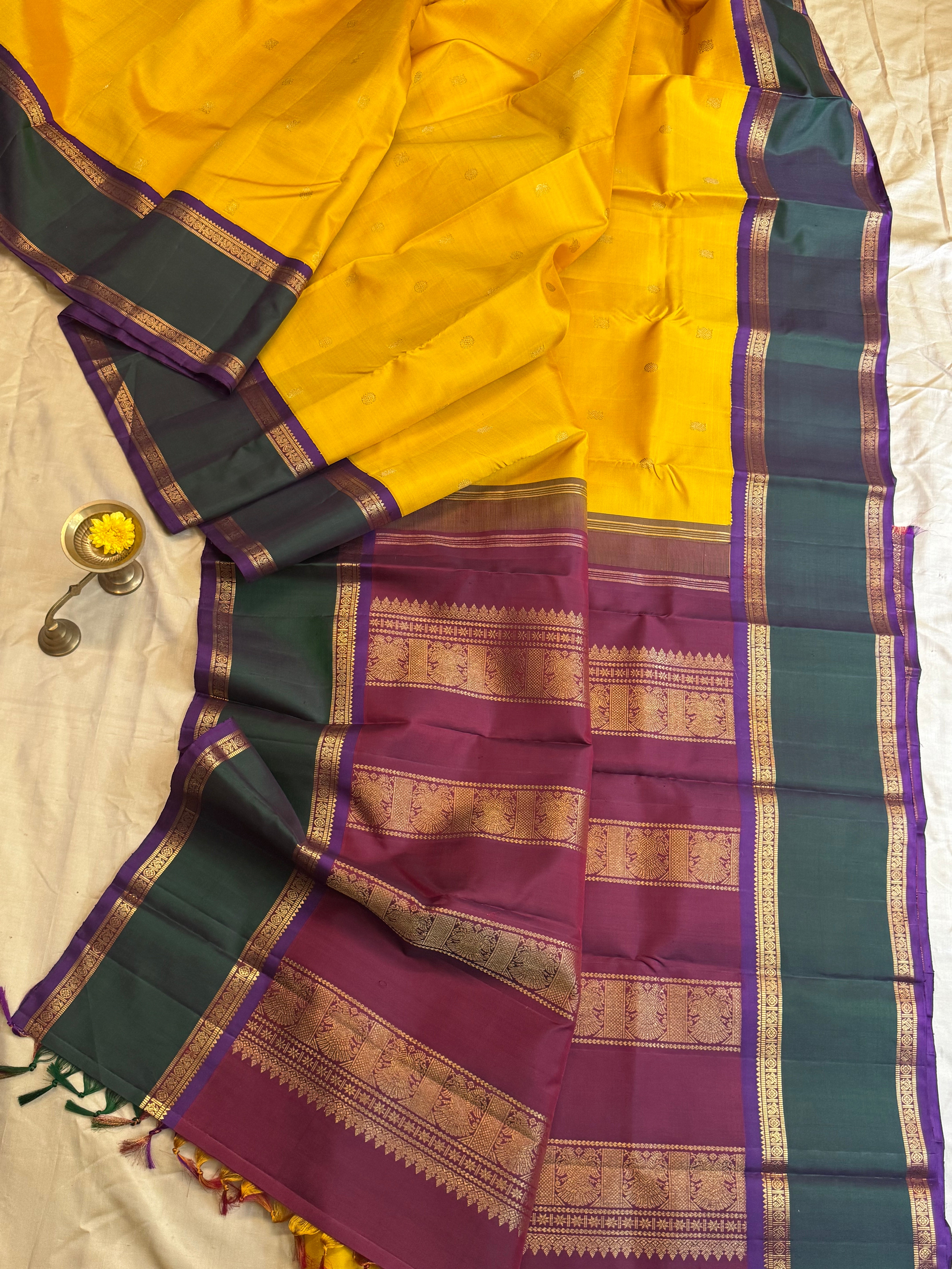 Golden yellow Korvai kanjipuram silk.
