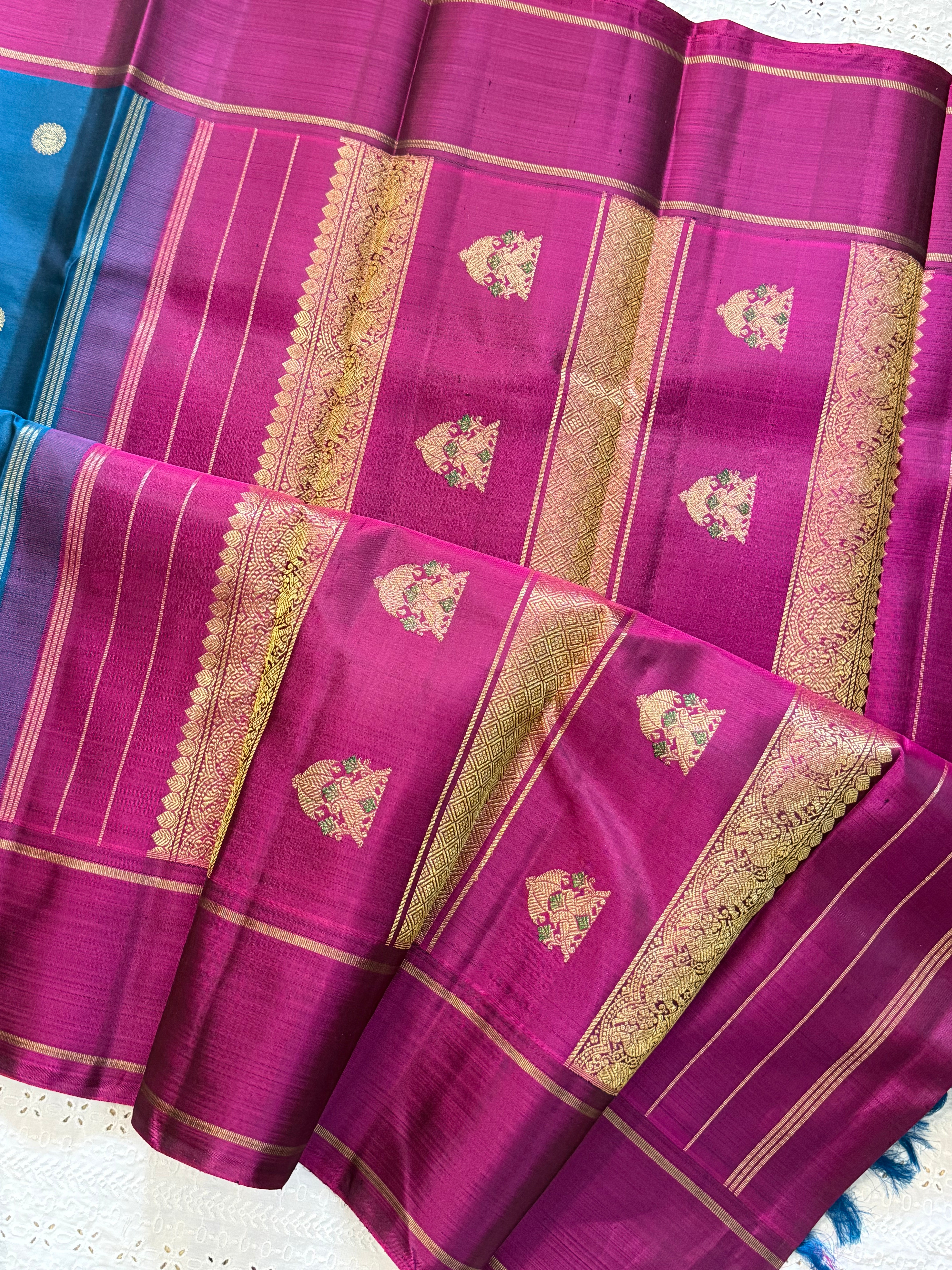 Peacock blue yazhi and chakram butta / Kanjipuram silk