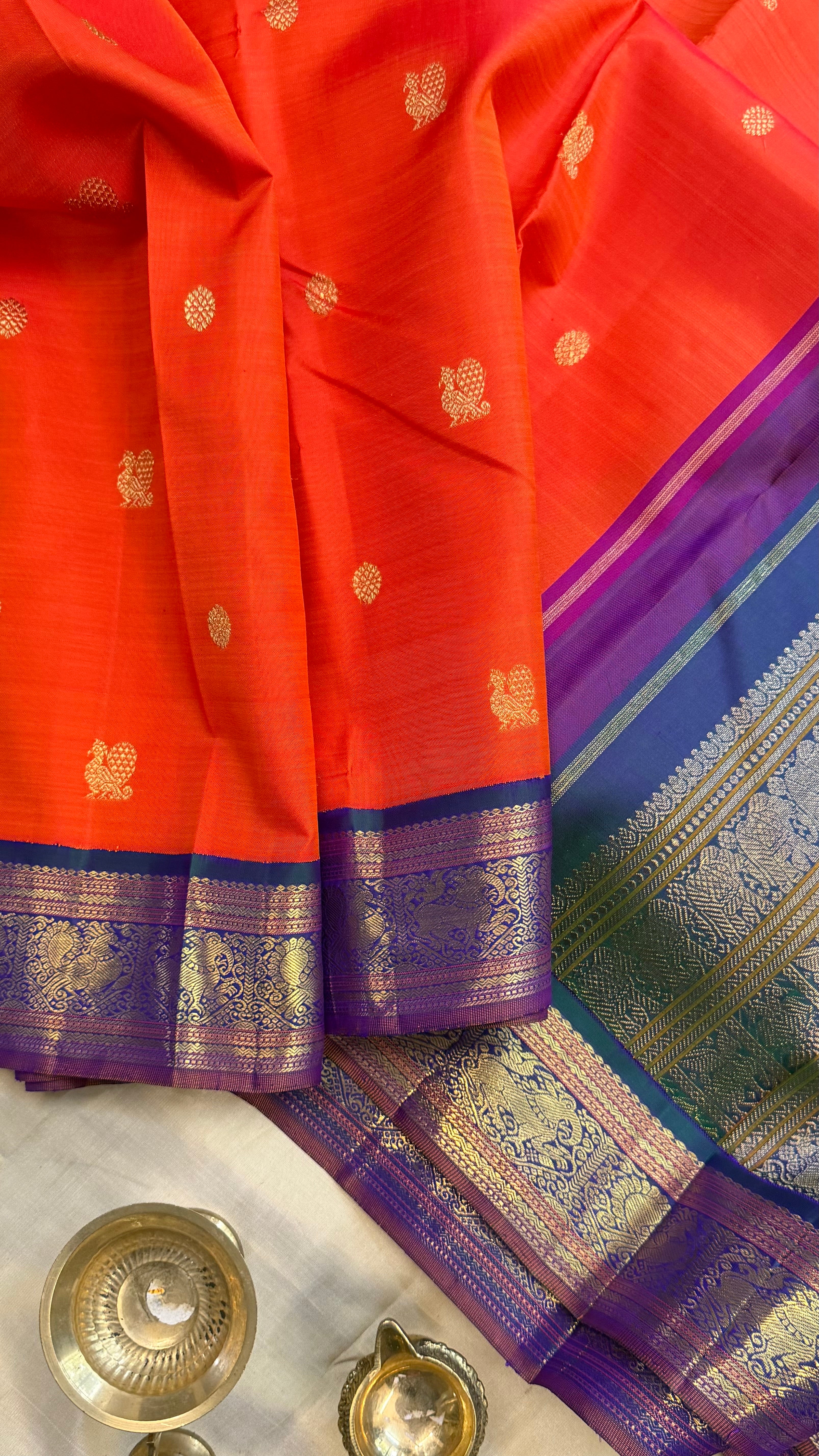 Orange and mayilkazhuthu Kai Korvai/Kanjipuram silk