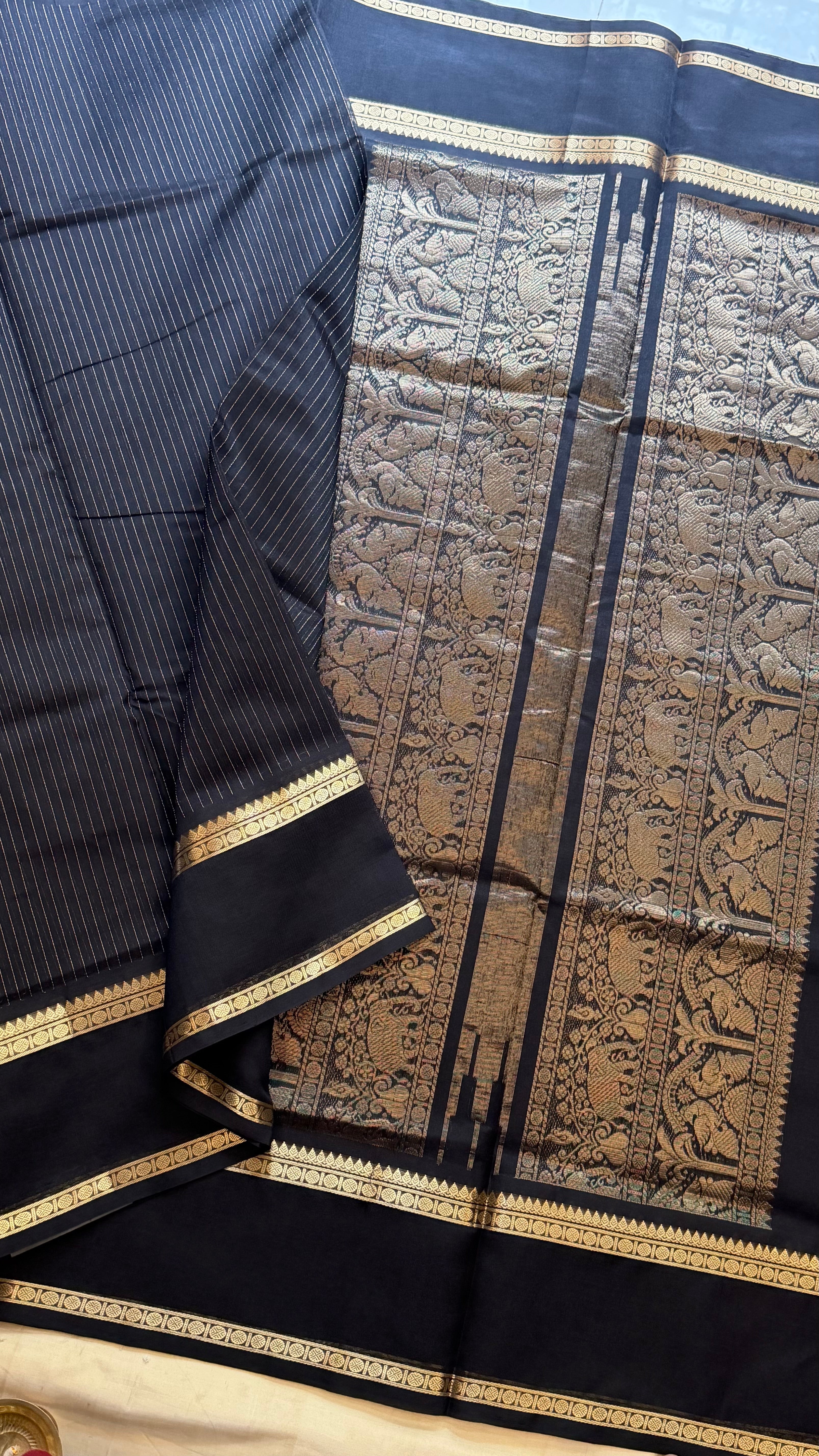 Muthu Oosi black silk cotton.
