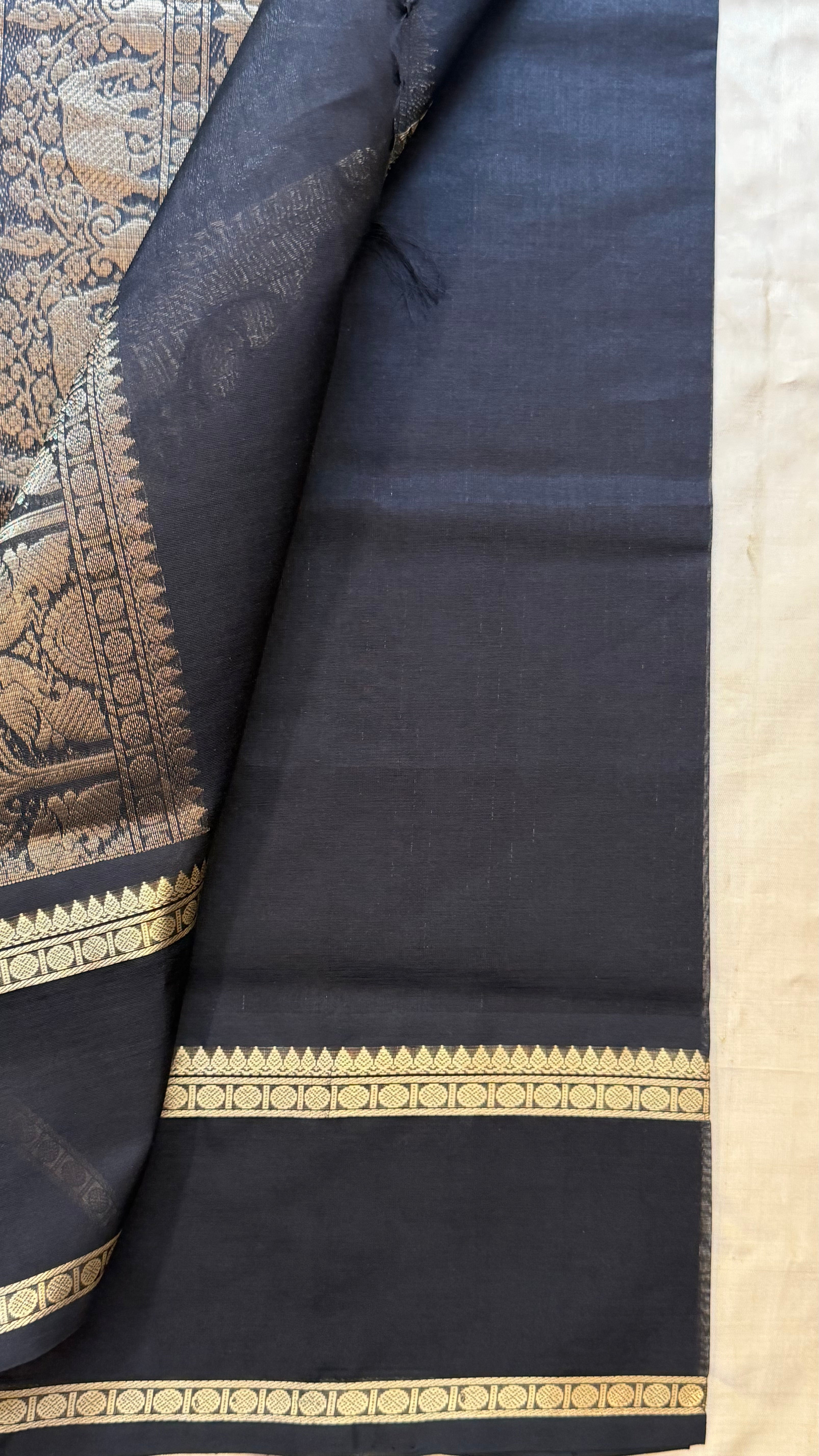 Muthu Oosi black silk cotton.