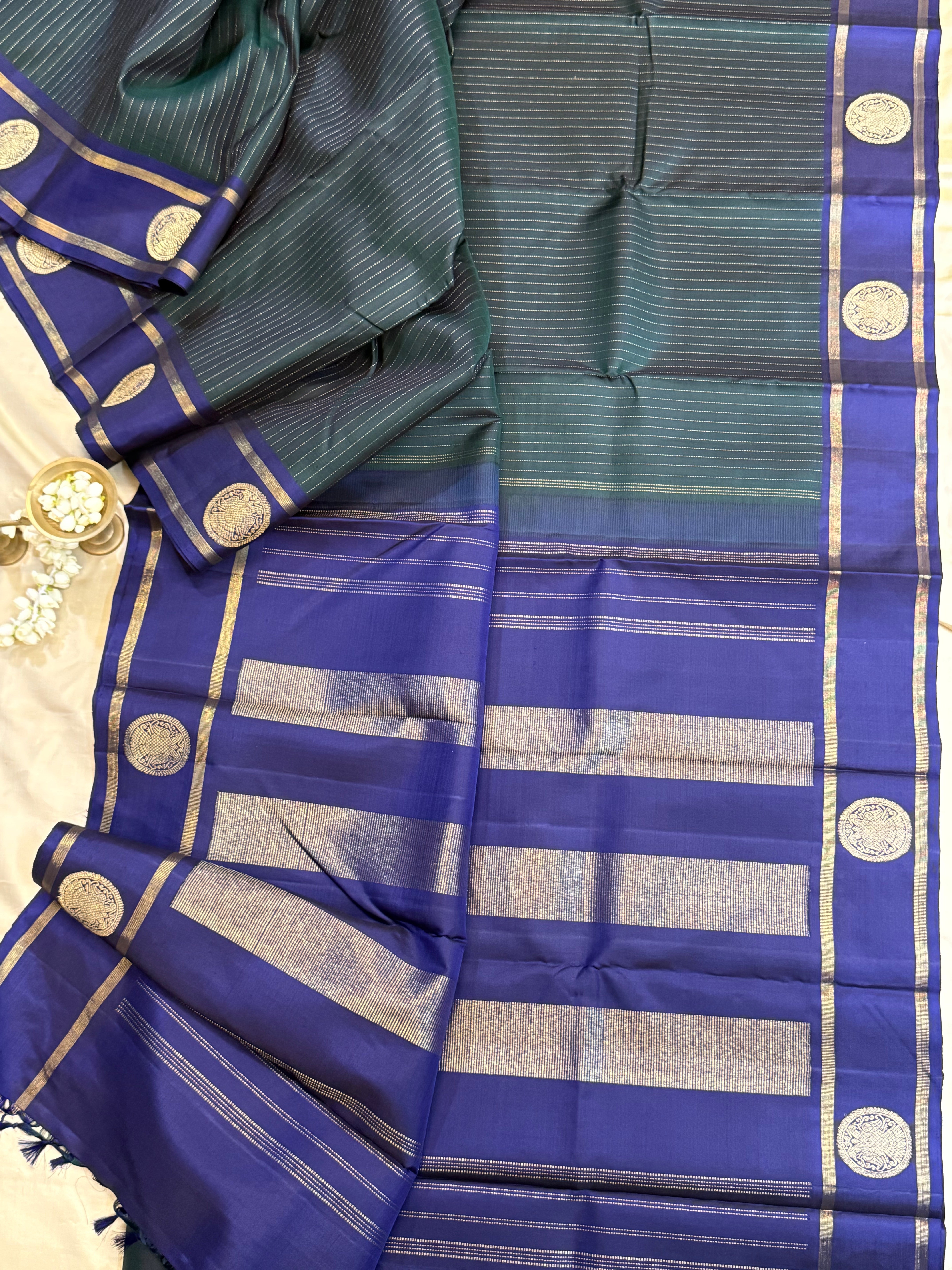 Dark green and violet oosi stripes border butta / Kanjipuram silk