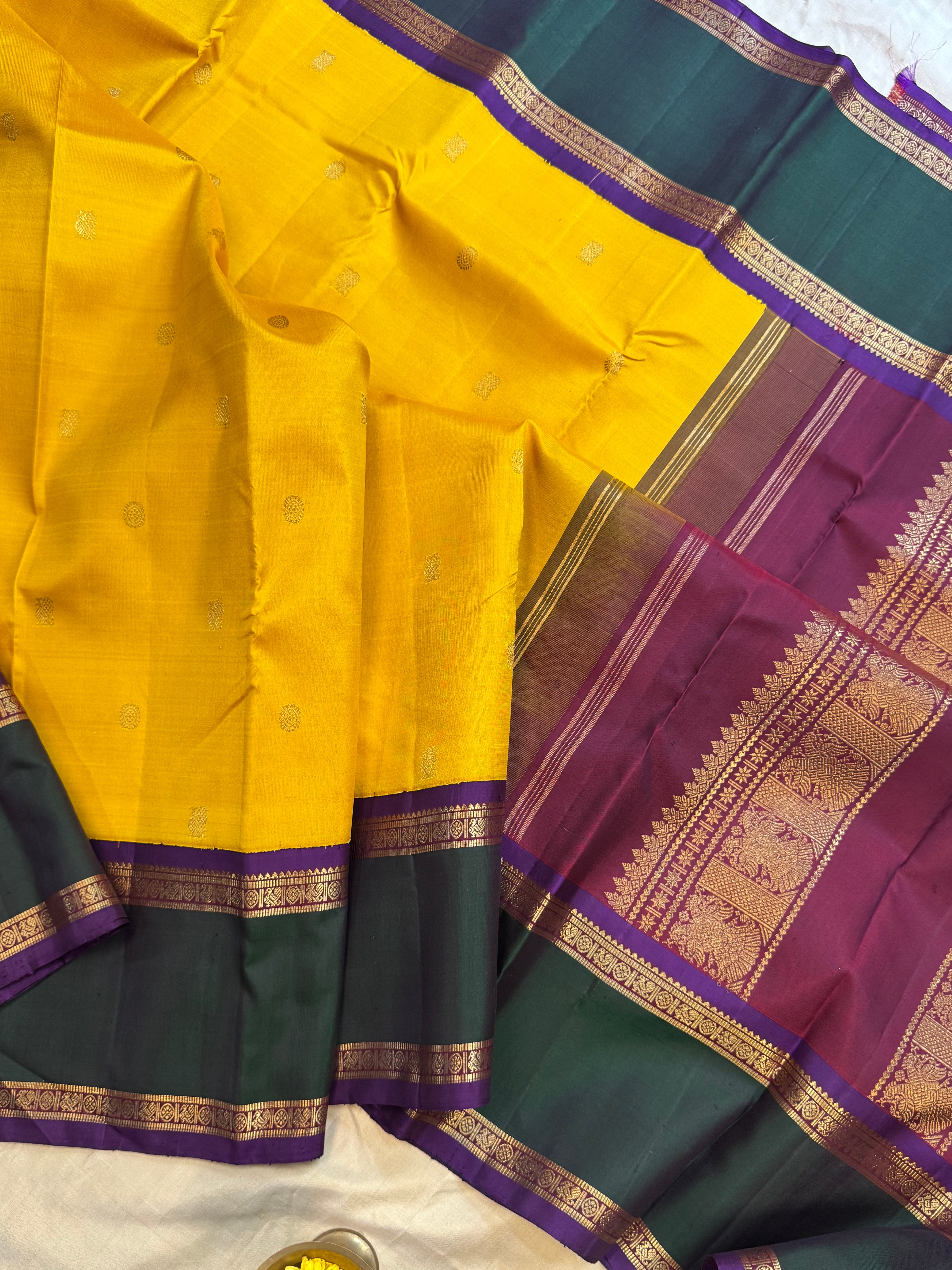 Golden yellow Korvai kanjipuram silk.