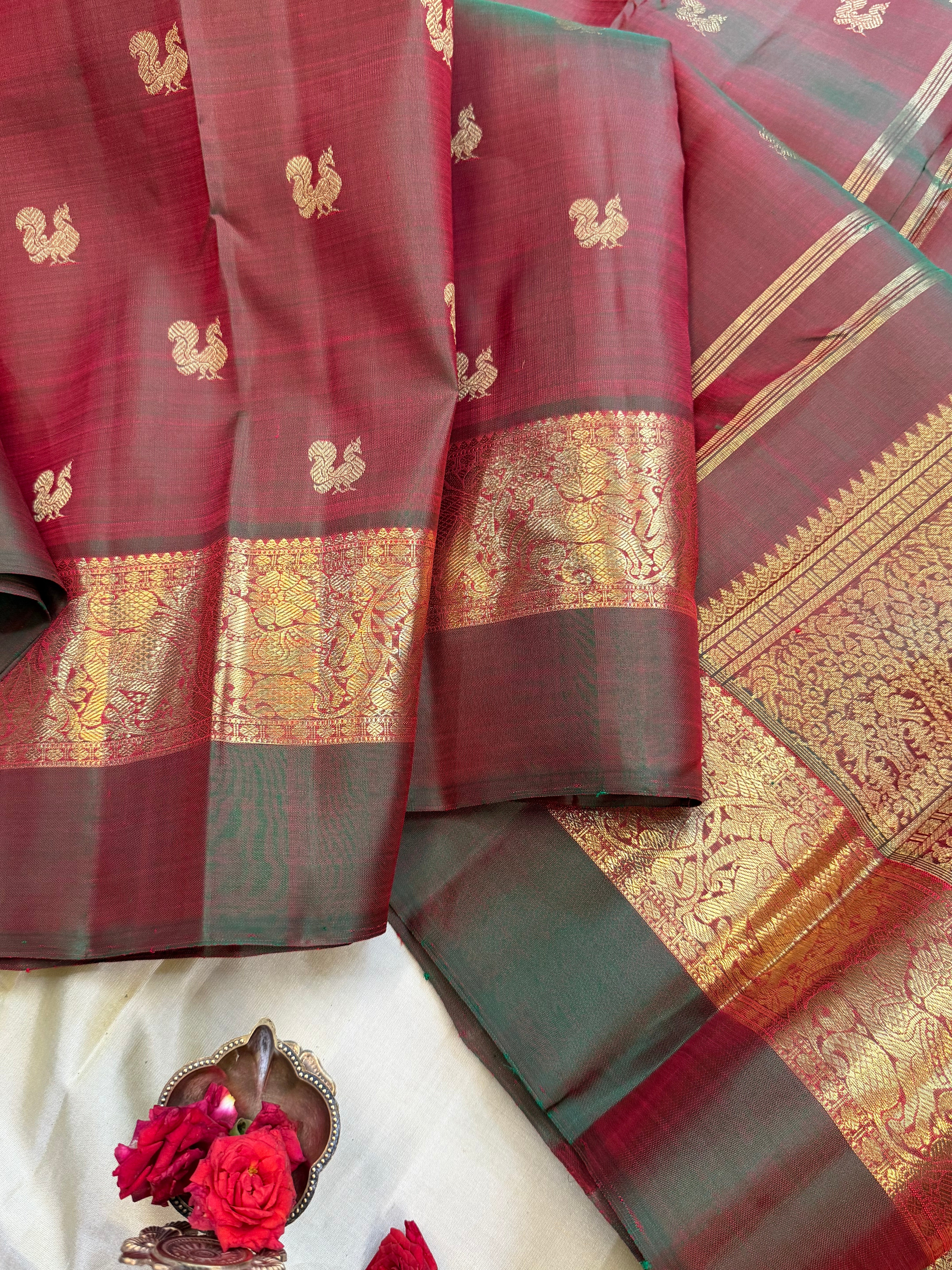 Mann : kaal erangina border earthy hues in pure Zari Kanjipuram silk