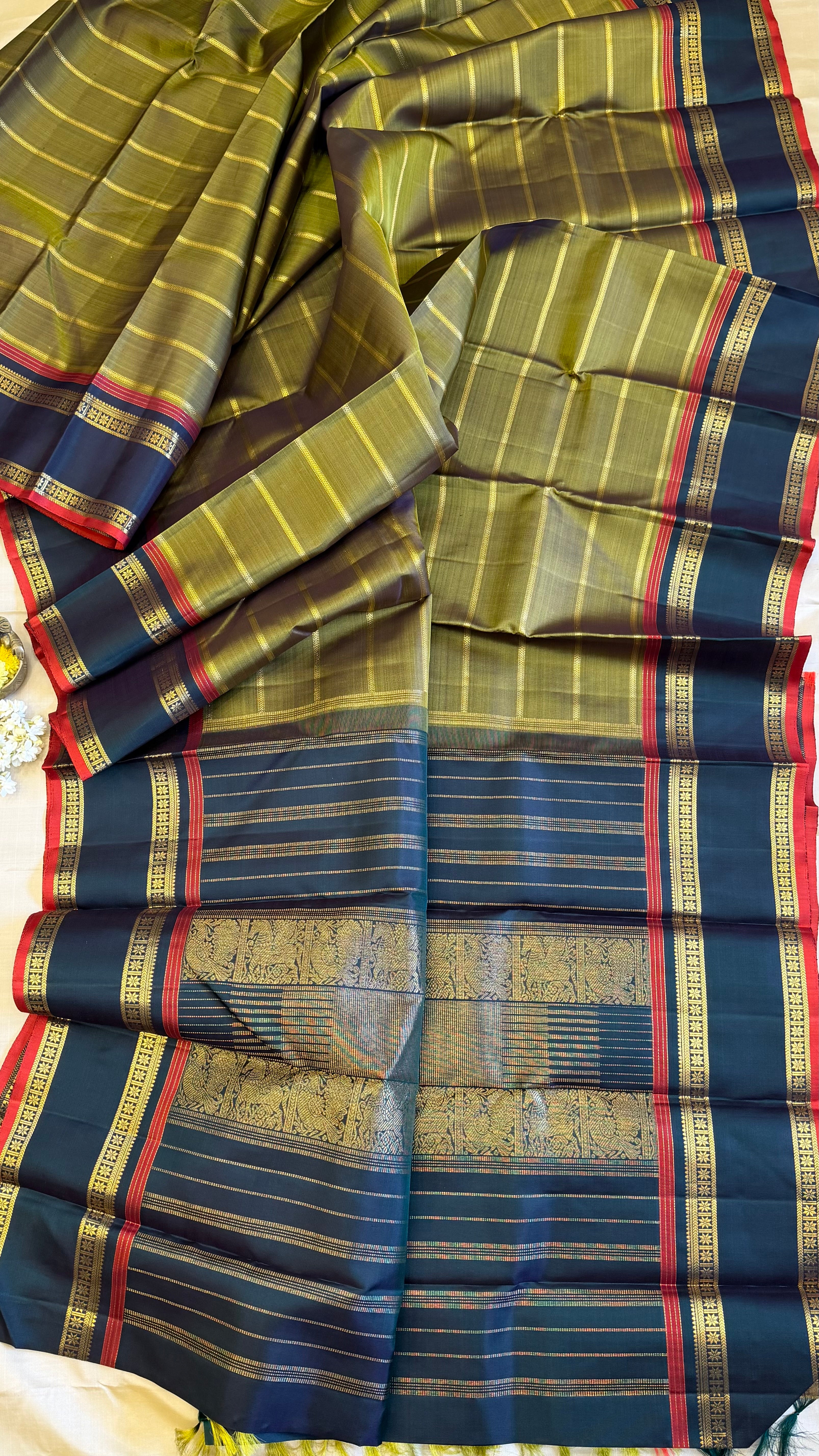 Mehandi green veldhari and rettapet border/ kanjipuram silk