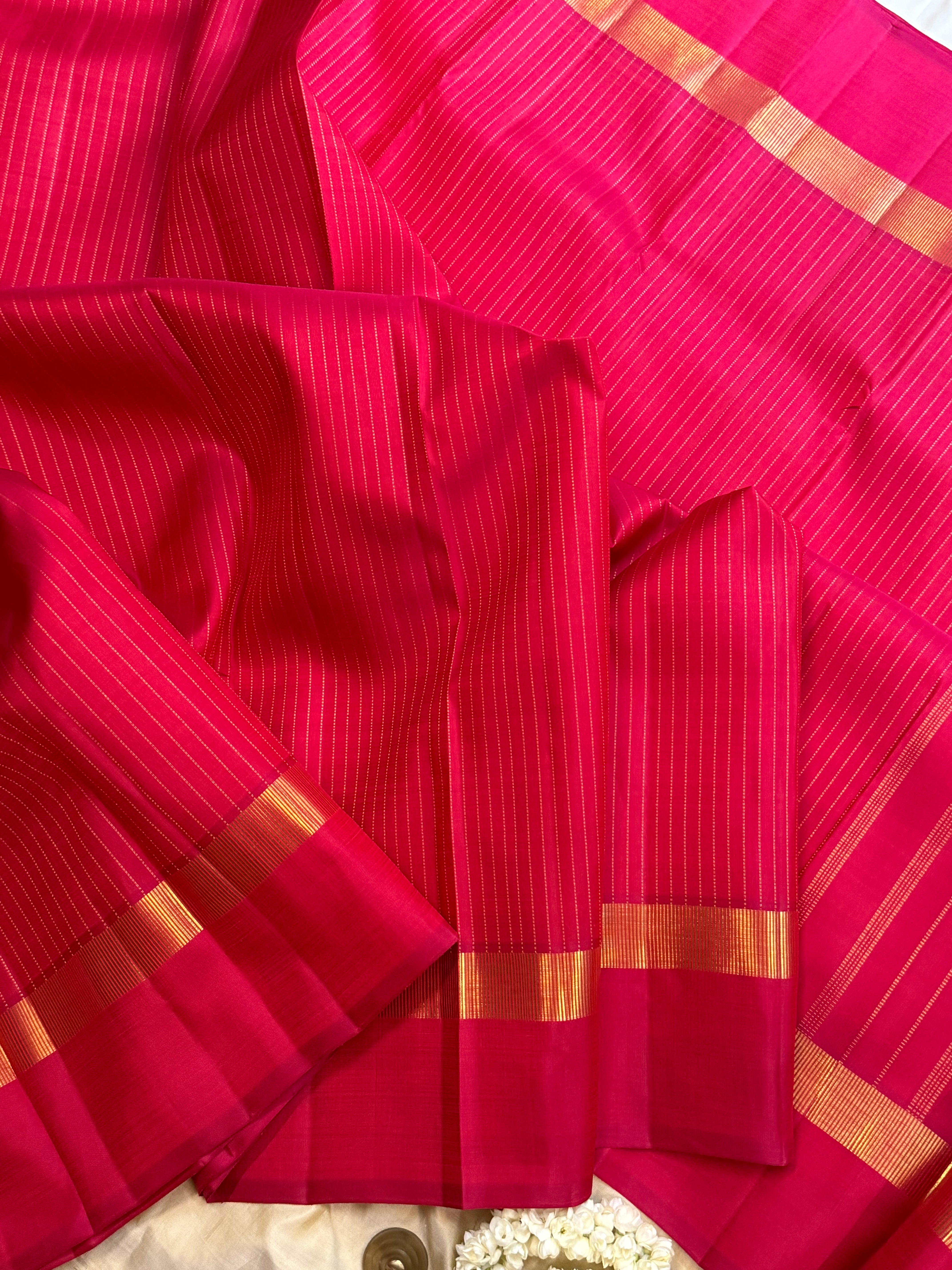 Pinkish red oosi zari lines kaal erangina border/ Kanjipuram silk
