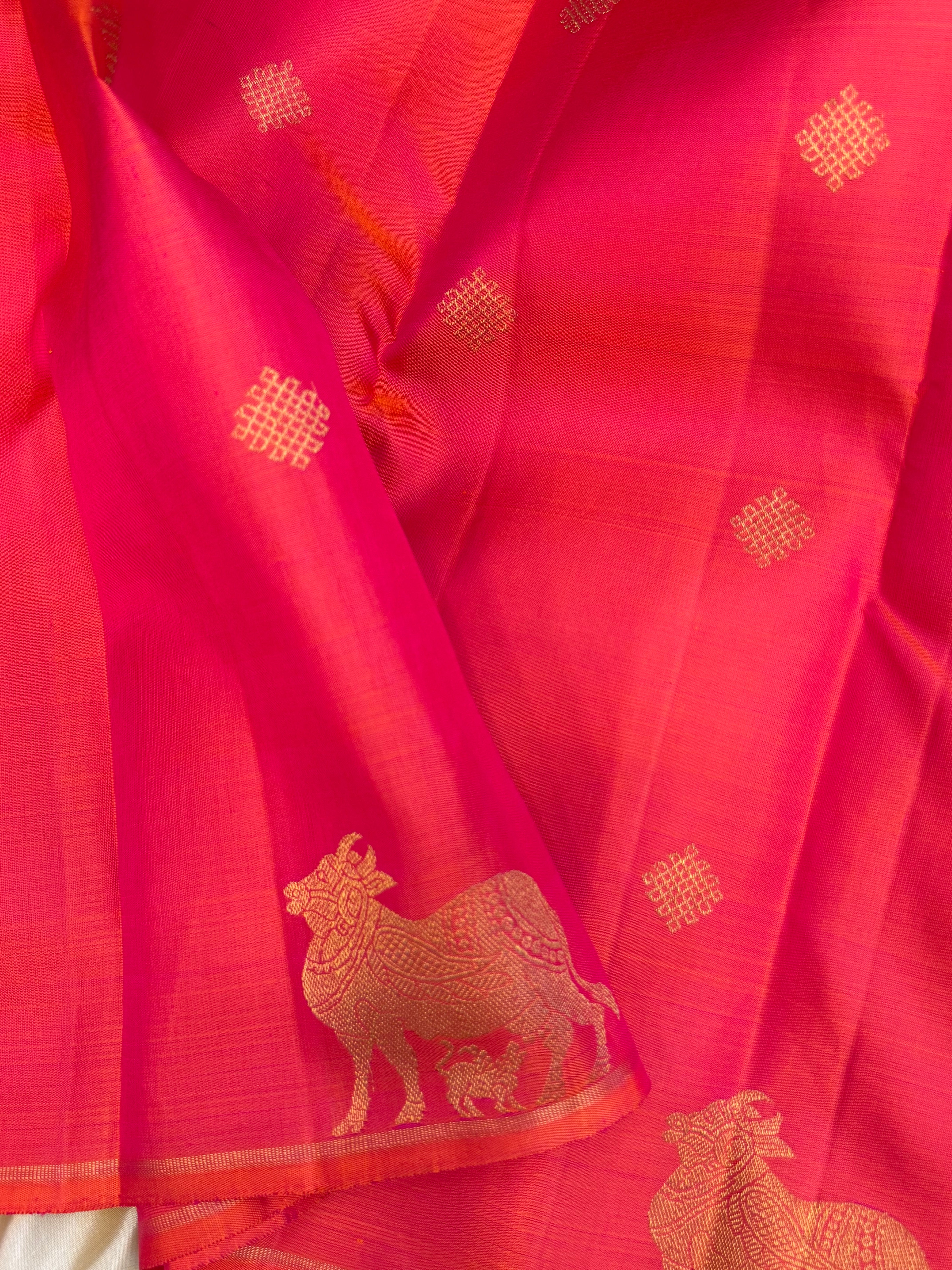 Pinkish orange and mayilkazhuthu komatha and kolam butta / Kanjipuram Silk