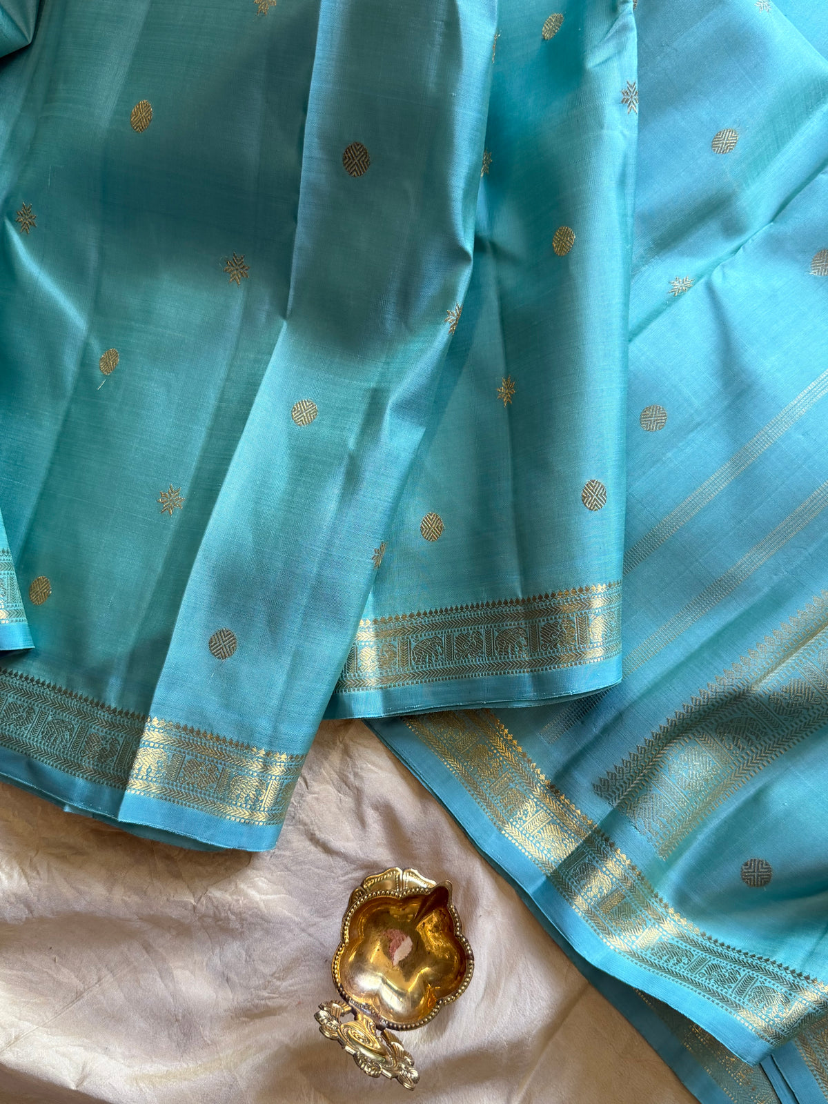 Pastel powder blue  color pure Zari pencil border Kanjipuram