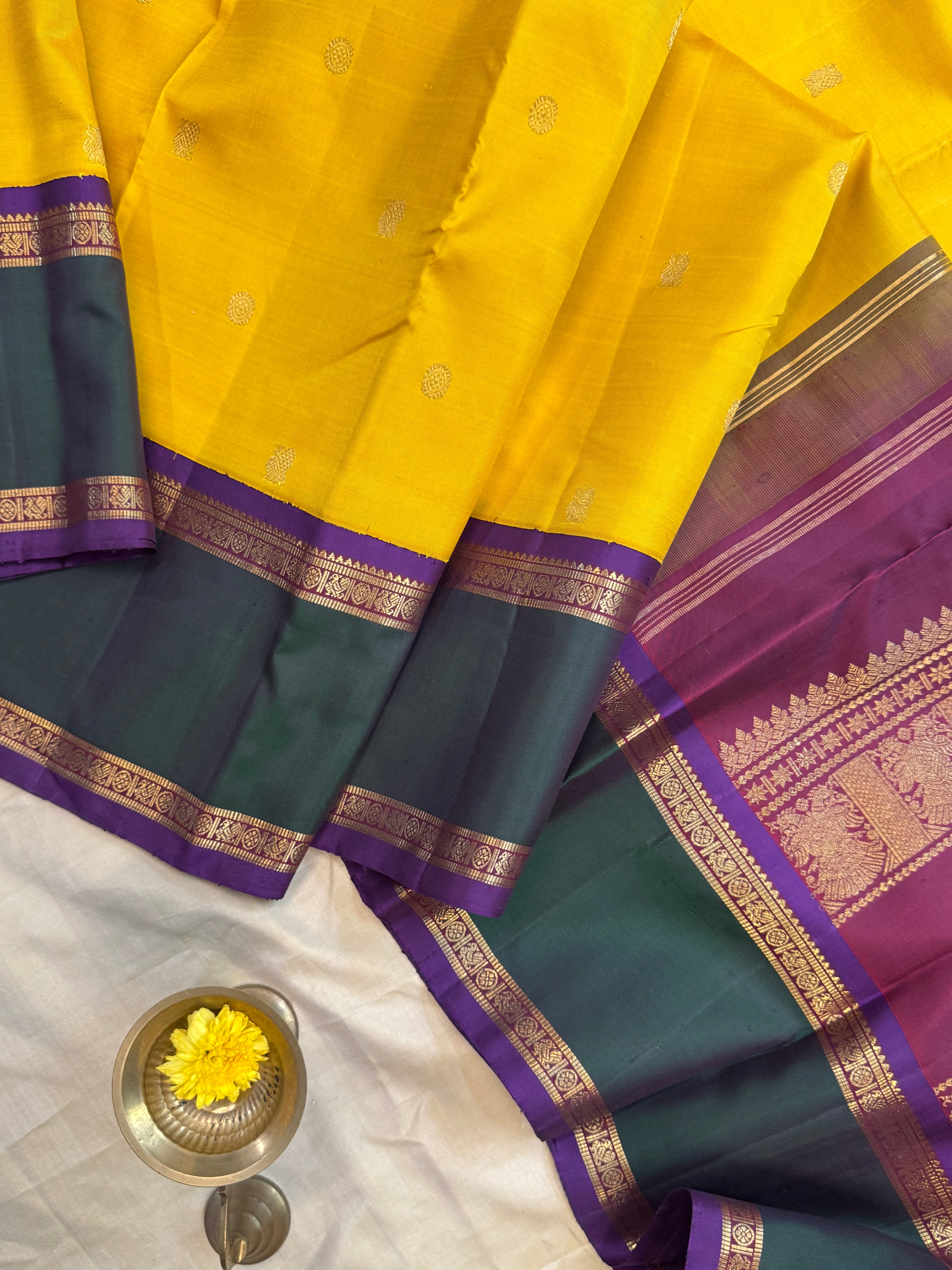 Golden yellow Korvai kanjipuram silk.
