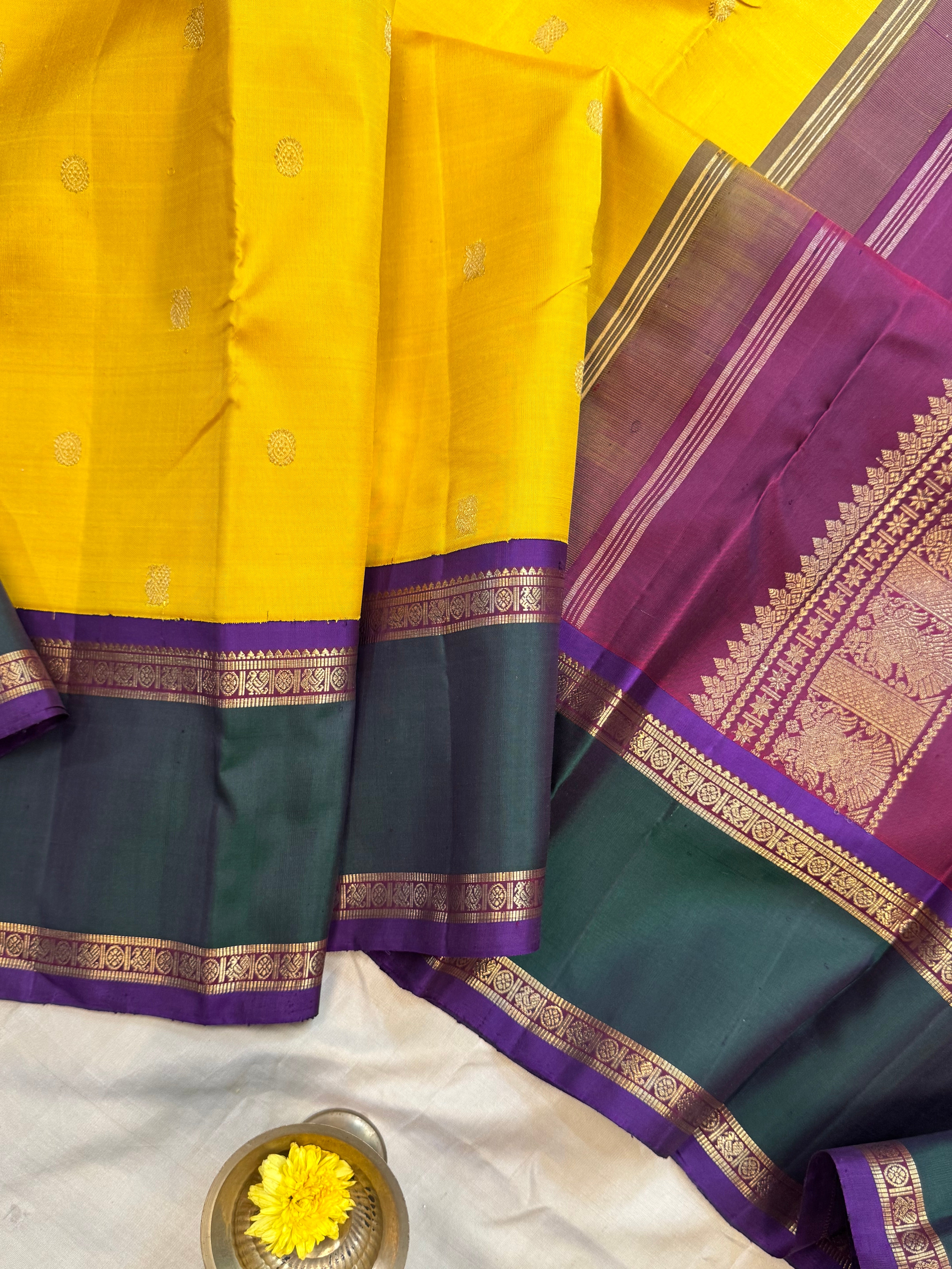 Golden yellow Korvai kanjipuram silk.