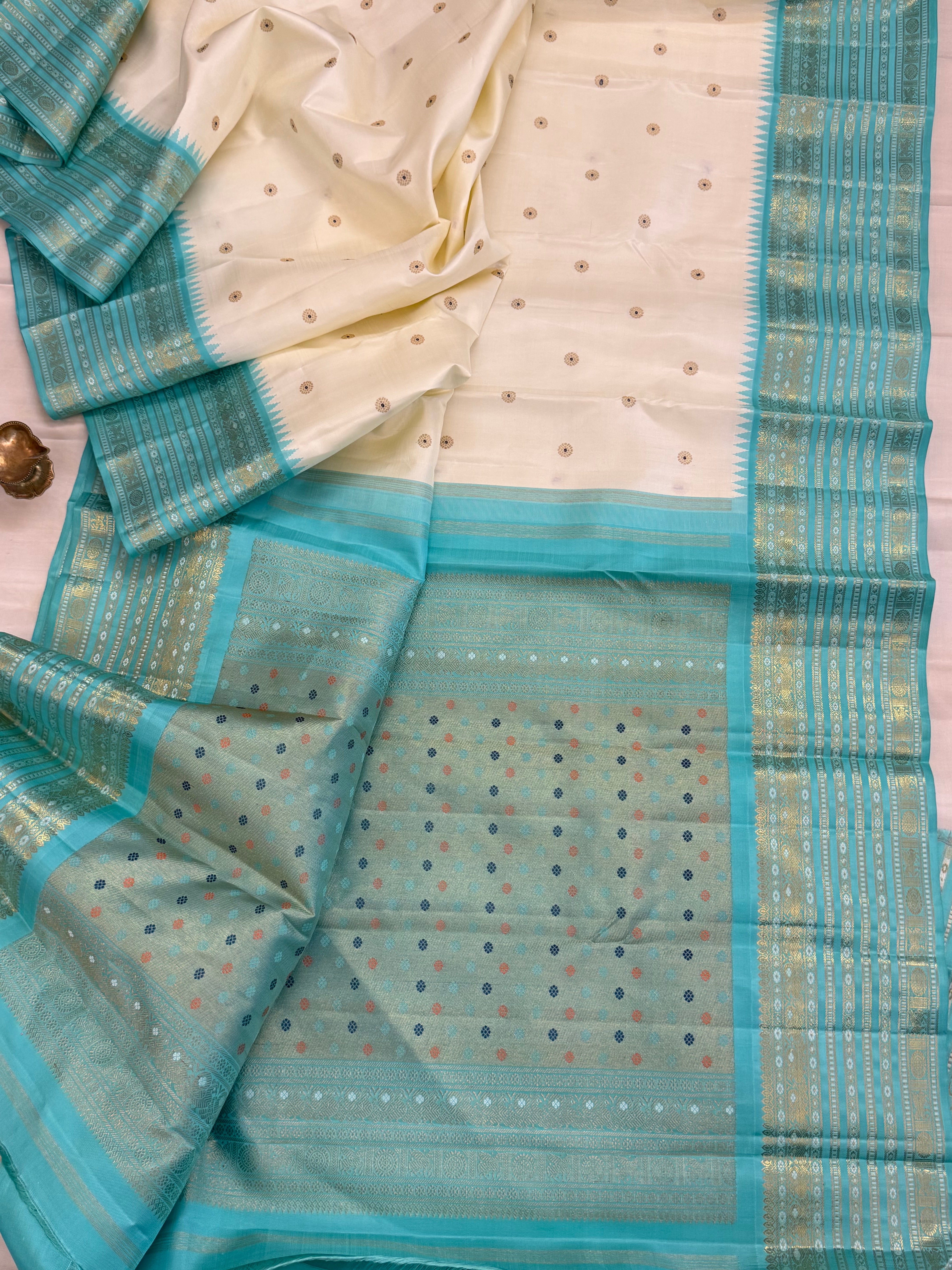 Off white with aqua blue Meenakari Butta with varisapet border Korvai /  kanjipuram silk saree