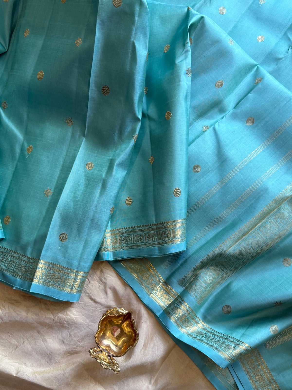 Pastel powder blue  color pure Zari pencil border Kanjipuram