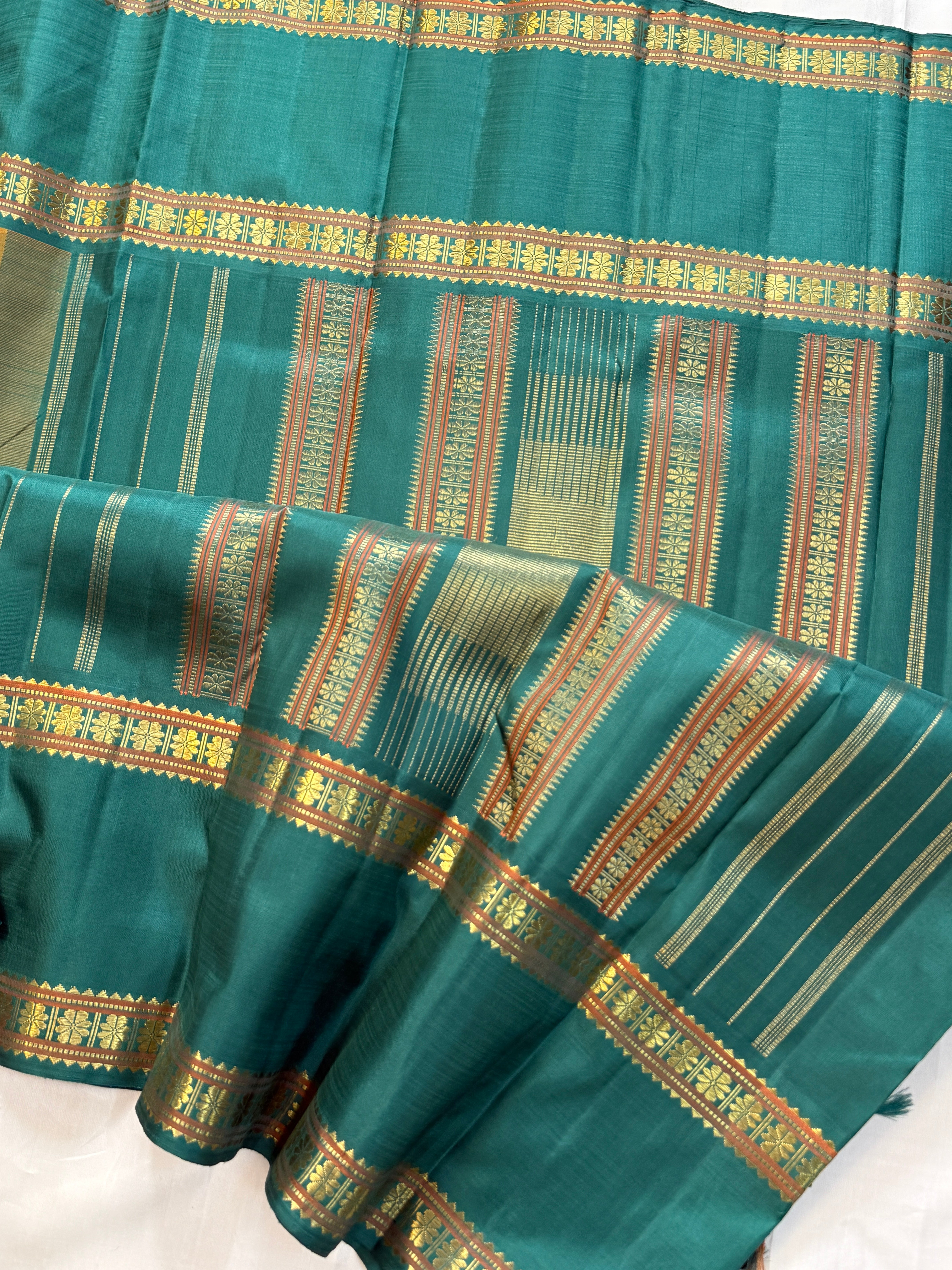 Rustic orange coin thread and zari butta on body with Retta pet / Kanchipuram silk CLSA11599