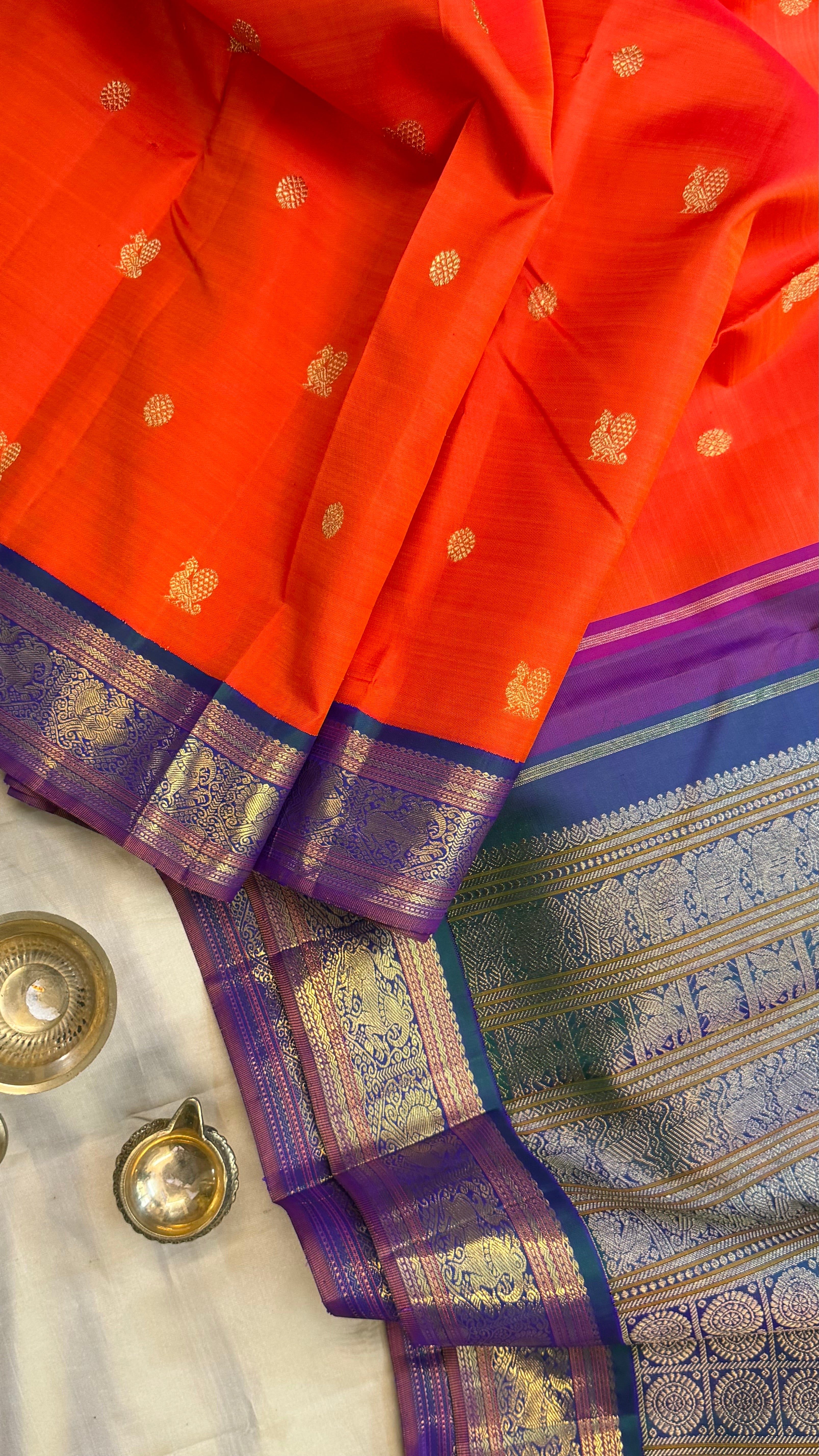 Orange and mayilkazhuthu Kai Korvai/Kanjipuram silk
