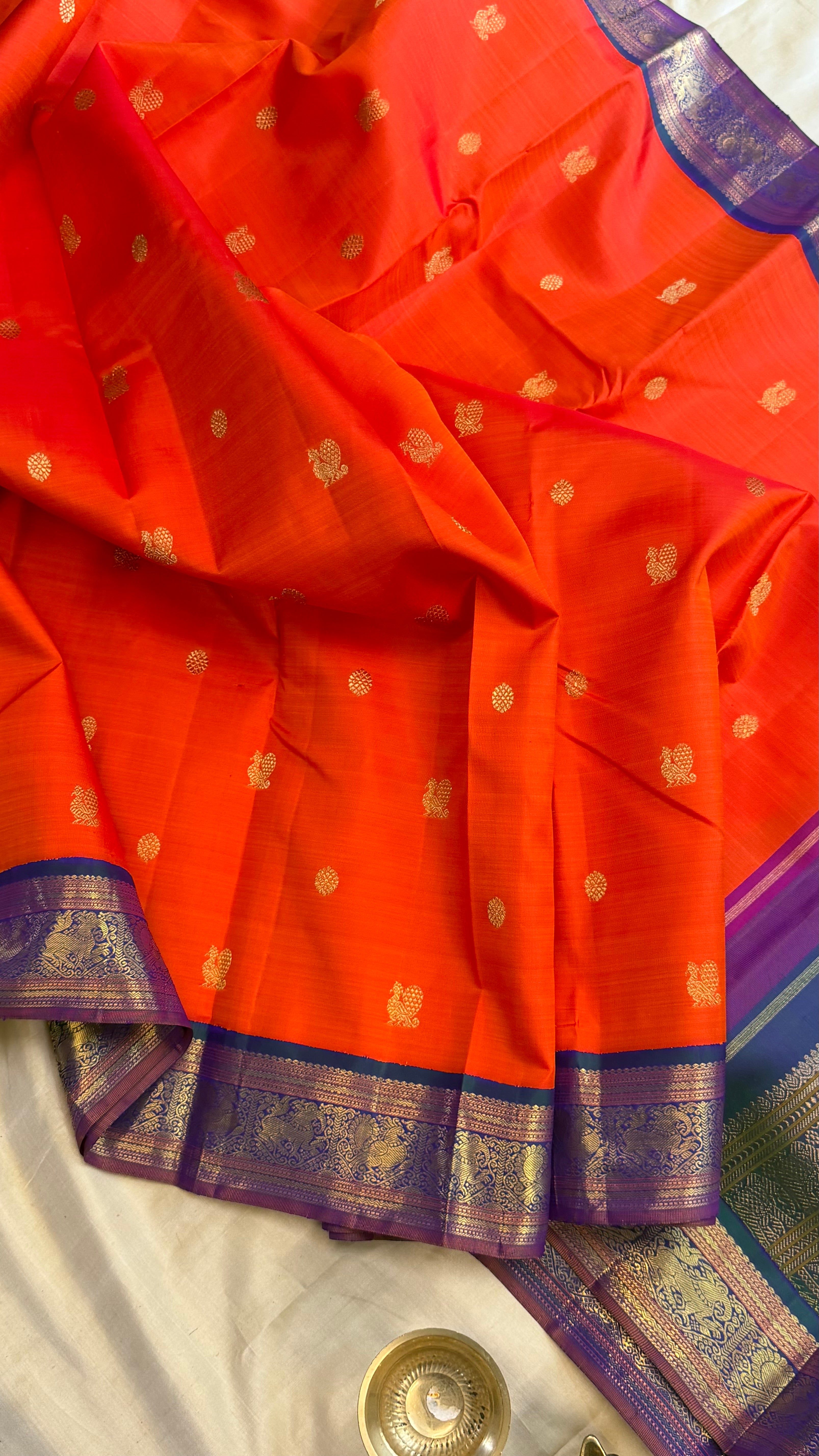 Orange and mayilkazhuthu Kai Korvai/Kanjipuram silk