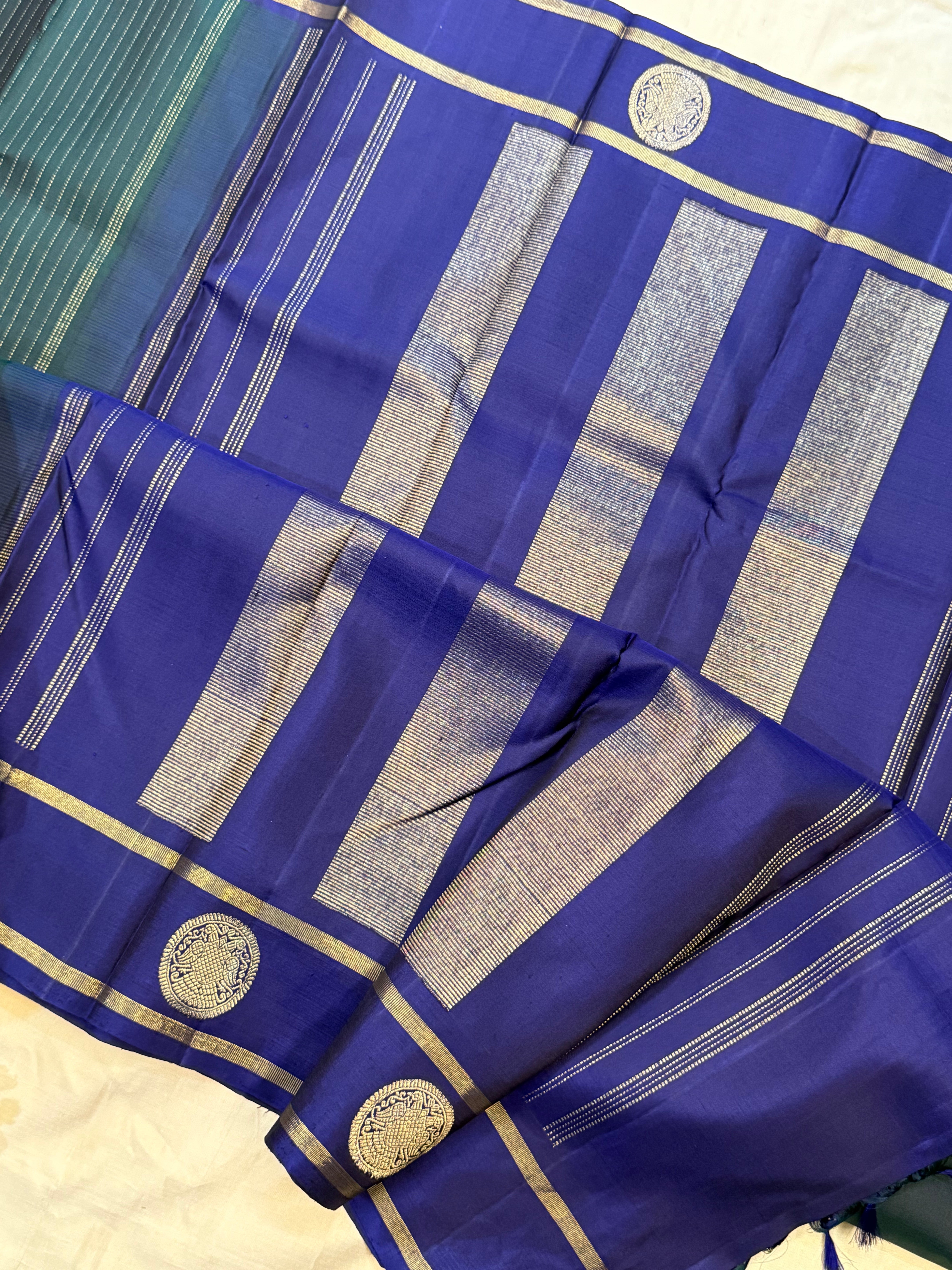Dark green and violet oosi stripes border butta / Kanjipuram silk