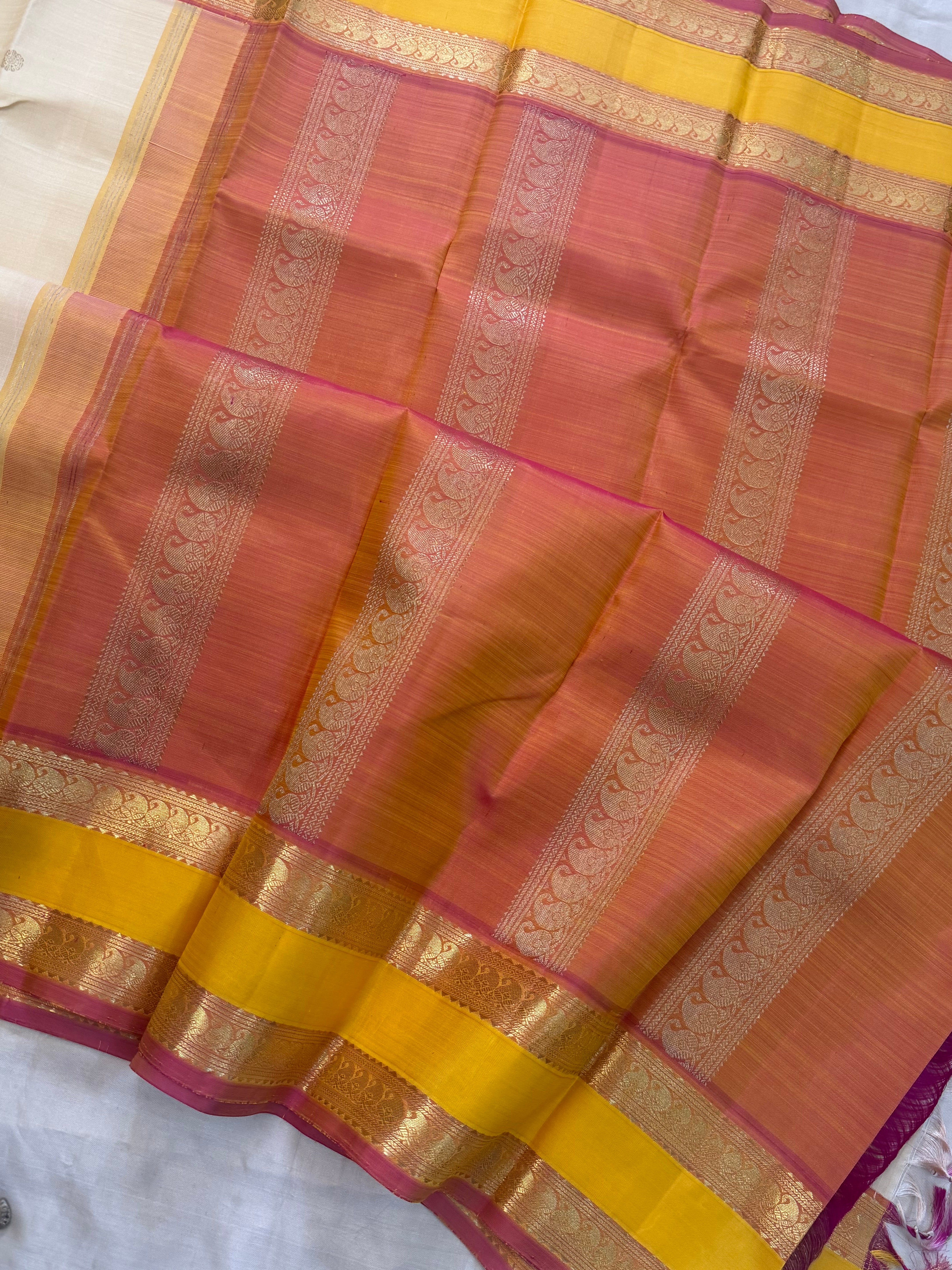 Onam collection:  cream retta pet Korvai / pure zari Kanjipuram silk