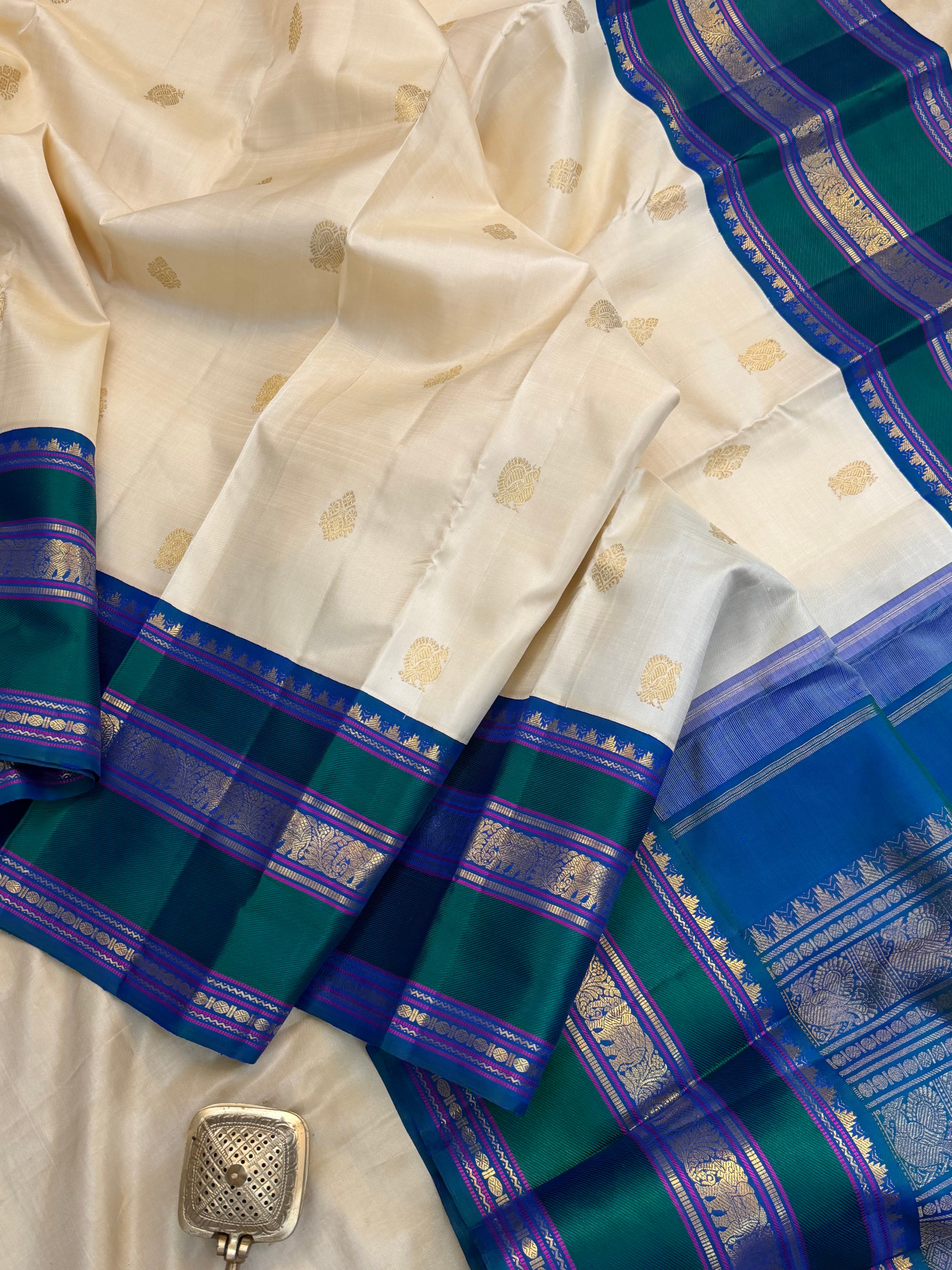 Onam collection:  off white triple pet Korvai / pure zari Kanjipuram silk