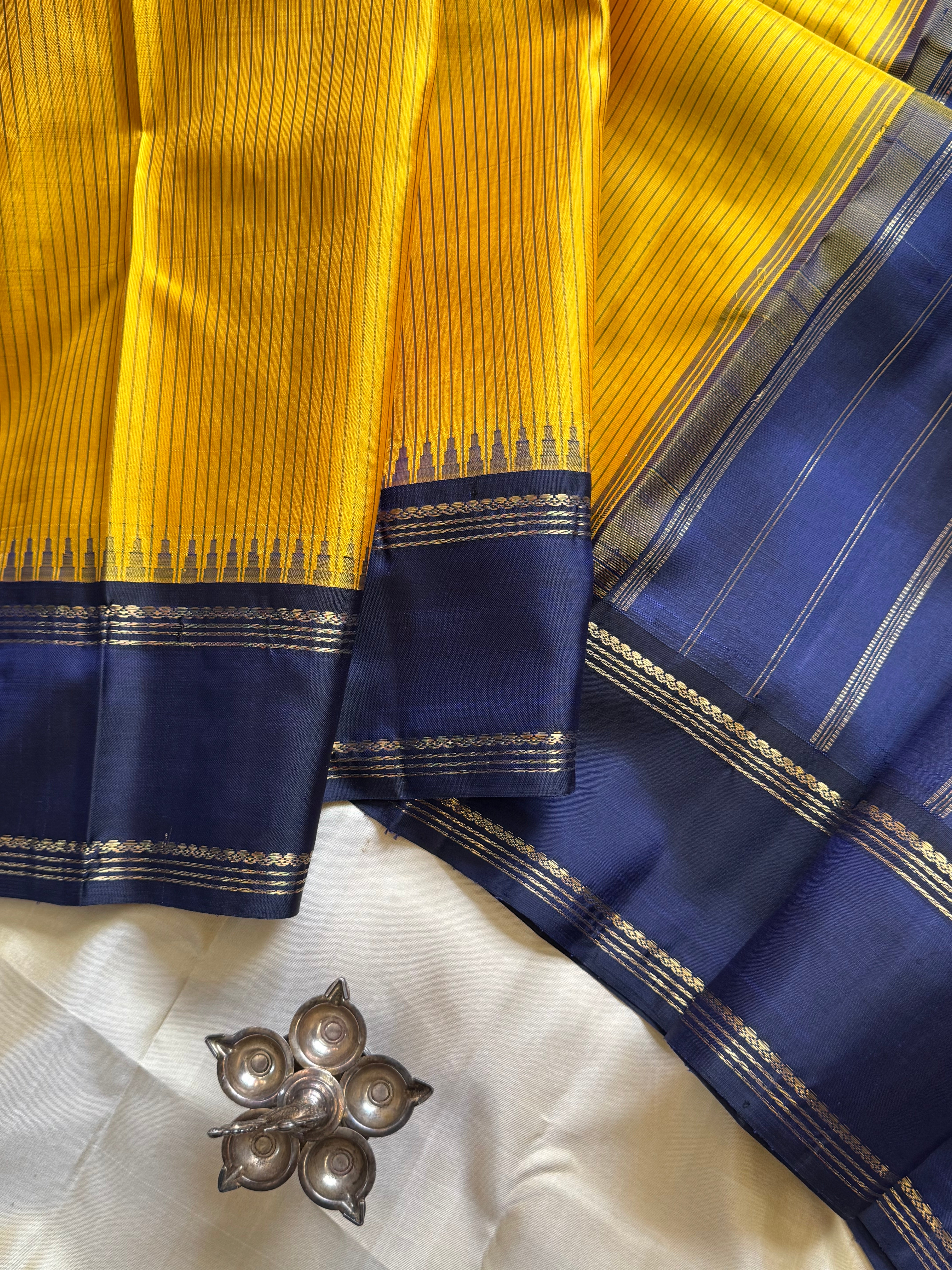 Mustard yellow and dark blue kai korvai / kanjipuram silk