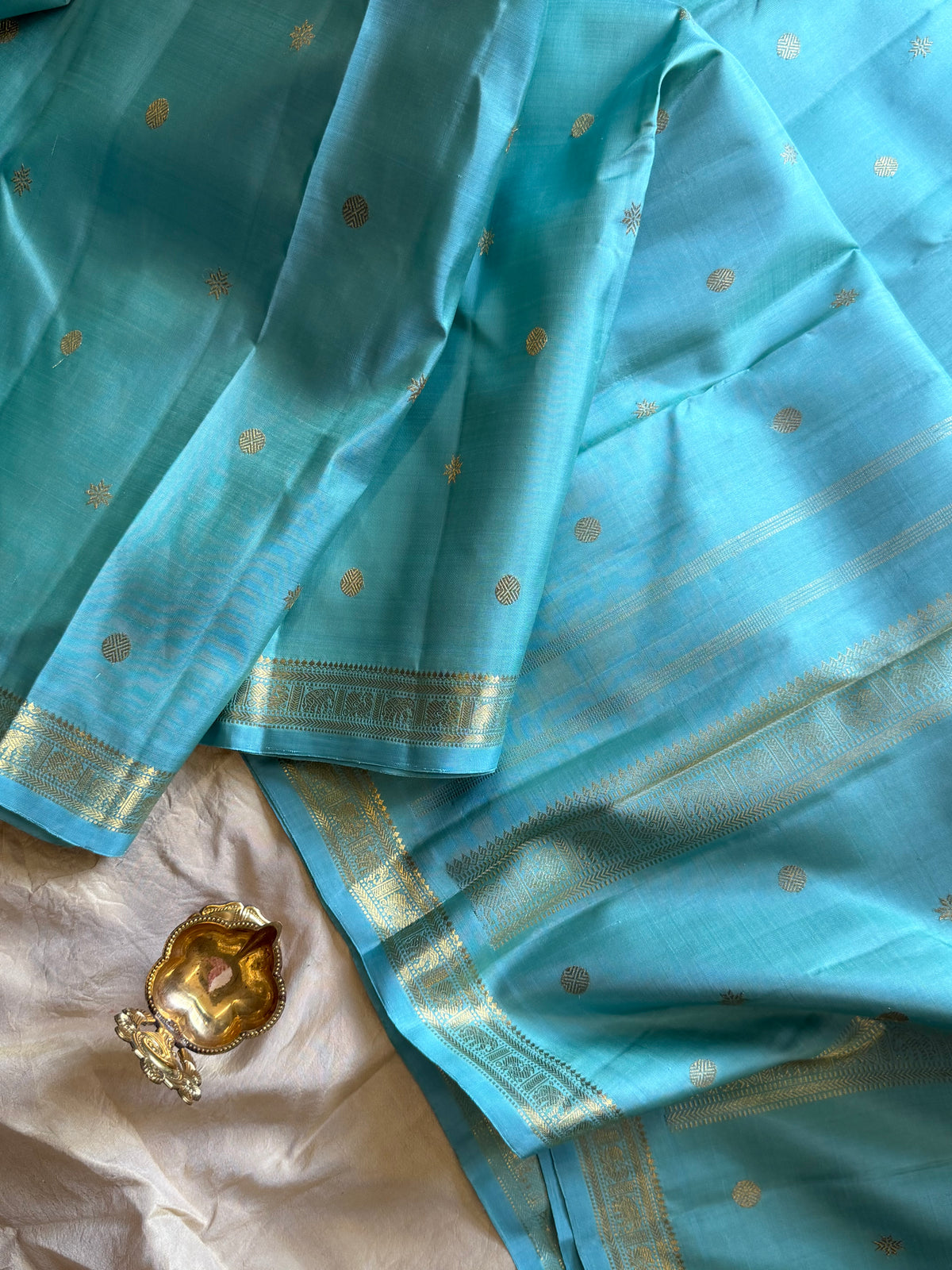 Pastel powder blue  color pure Zari pencil border Kanjipuram