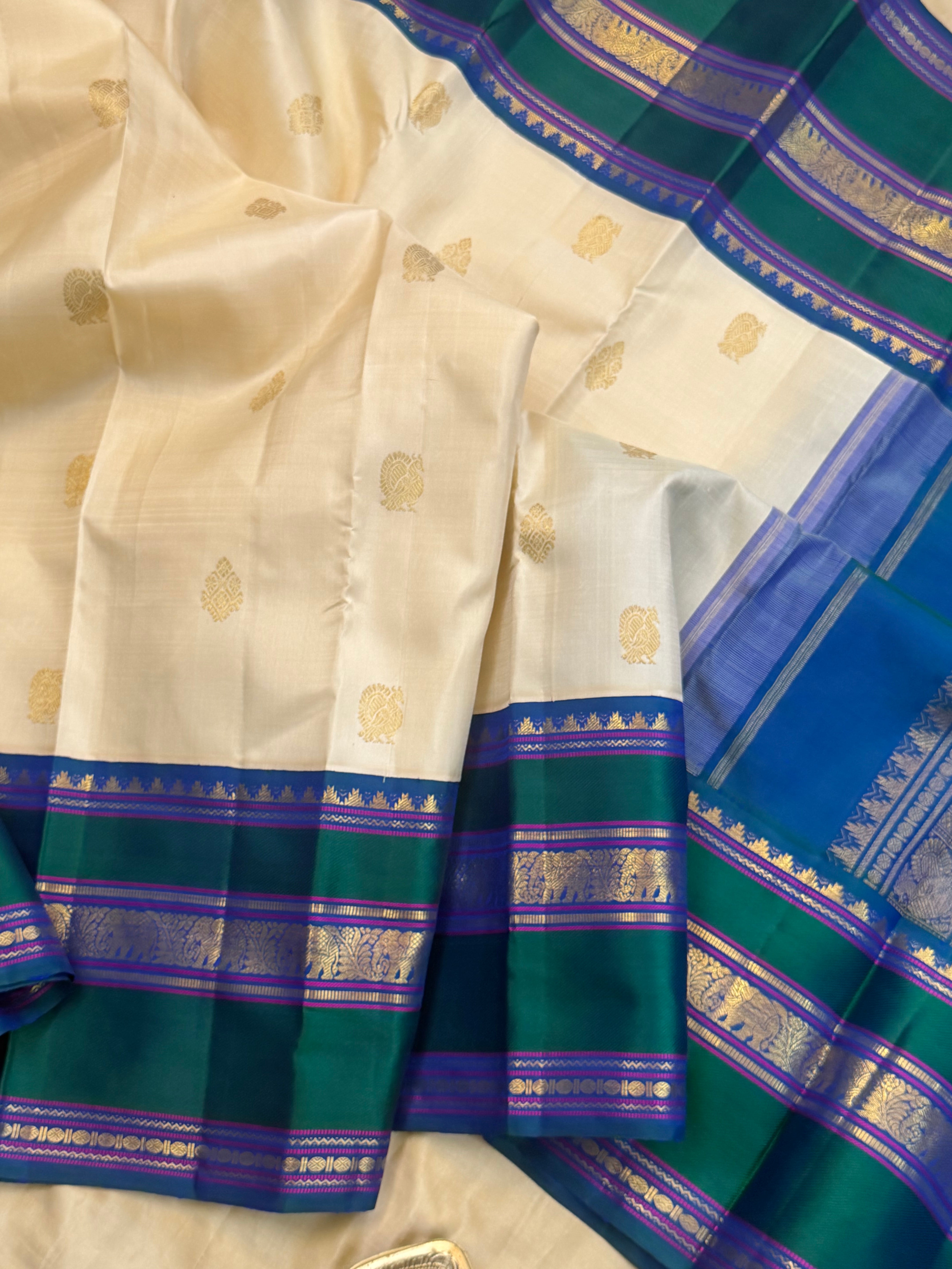 Onam collection:  off white triple pet Korvai / pure zari Kanjipuram silk