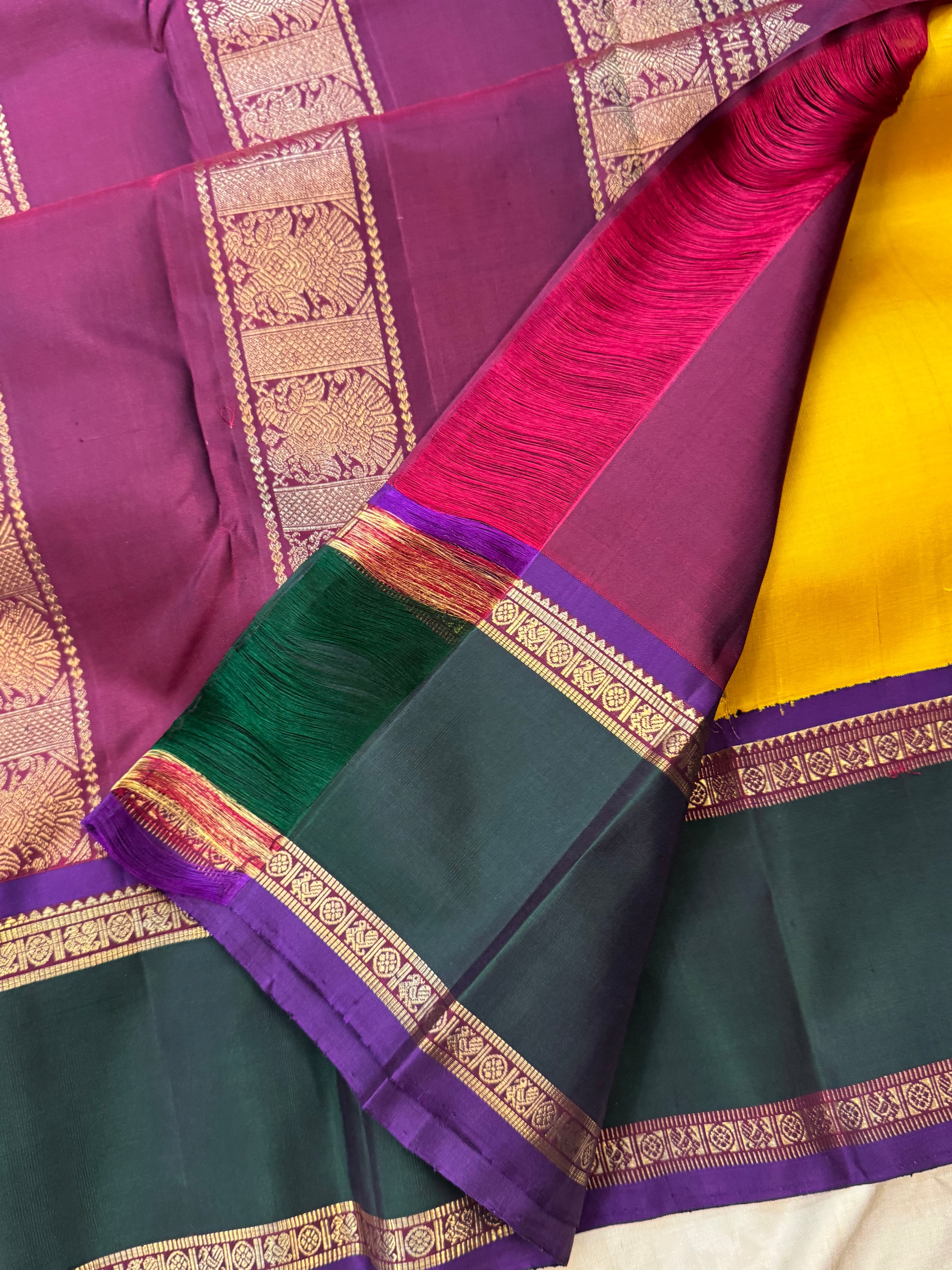 Golden yellow Korvai kanjipuram silk.